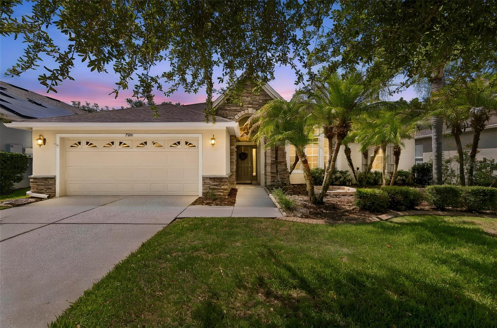 Welcome to this spectacular single-story David Weekley Built home featuring 3 bedrooms, 3 bathrooms, with office and formal dining-room, ideally situated on a beautiful conservation lot in the highly sought-after Wilderness Lake Preserve community.
From the moment you arrive, you'll be captivated by the home's charm. Don't let the two-car garage door fool you—a rare 3-car tandem garage offers space for a third vehicle, golf cart, workshop, or additional storage.
Designed with both comfort and entertaining in mind, the spacious kitchen boasts 42 inch solid wood cabinetry, abundant countertop space, a center island, a pantry, and updated appliances, including a brand-new refrigerator. The kitchen opens seamlessly to the expansive family room, creating the perfect gathering space for family and friends. Large windows throughout the home fill the living areas with natural light, creating a warm and inviting atmosphere.

The thoughtfully designed split-bedroom floor plan offers exceptional privacy, with each bedroom situated in its own wing of the home. A highly desirable flex space located between the two secondary bedrooms provides endless possibilities as a playroom, media room, game room, or additional living area. A dedicated pool bath is already in place should you choose to add a private pool in the future.
The spacious primary suite serves as a private retreat, featuring a sitting area overlooking the conservation views, dual vanities, a soaking tub, separate walk-in shower, and an oversized walk-in closet. 

Additional updates include a newer HVAC system, Tankless Electric Water Heater, Roof replaced in September 2022 and Solar panels on the rear roof, all of which will save you big dollars on your electric bills, offering you peace of mind for years to come. ..................................
Why build your own pool when you can enjoy the incredible resort-style amenities offered by Wilderness Lake Preserve? Residents have access to the stunning Wilderness Lodge, featuring a lagoon pool, heated lap pool, outdoor hot tub, two fishing docks, boats for lake access, a lakefront fitness center with saunas, tennis and pickleball courts, basketball and sand volleyball courts, a movie theater, nature center, playgrounds, parks, a three-story treehouse, activity center, party room, picnic facilities, and a full calendar of community events.
Conveniently located in one of Tampa Bay's fastest-growing areas, you'll enjoy easy access to I-75, the Suncoast Parkway, Tampa Premium Outlets, The Shops at Wiregrass, multiple Publix locations, restaurants, medical facilities, pet services, and countless everyday conveniences. The home is also zoned for Land O' Lakes High School, an International Baccalaureate (IB) school (located directly across the street from the community.
If you're searching for a move-in ready, exceptionally well-built home with outstanding community amenities and a prime location, your search ends here.
*While your time for viewing can be tight, please ask your agent to leave enough time to tour the lodge and community amenities, your family will thank you*.