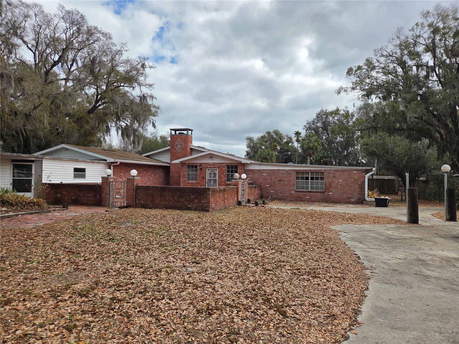 Country Paradise on 10.5 Acres!  The property consists of two parcels being sold together.  The main parcel is 10+ acres and features a huge 5 bedroom 3 bath home and a Guest cottage.  The main house contains over 6,000 sf of living area.  This home is perfect for entertaining!  There is a huge pool, a basketball court, a large grill.  There is room for livestock, etc. with the numerous pins.  There are additional outbuildings as well.  The outbuildings include one with 8 bays and 3 open bays, a 40x60 workshop for a Motorhome +3 bays workshop and much more.   There is a 30x40 barn for horses/livestock.  There is also a large pasture that has a small pond on the property.  The second tract is approximately 1/2 acre and features a 3 bedroom 2 bath mobile home that would make a great in-law or guest home or a nice rental property.  It includes a storage/workshop and its own well site.  This property must be seen to apprecitate.  Please call to schedule your private showing today!