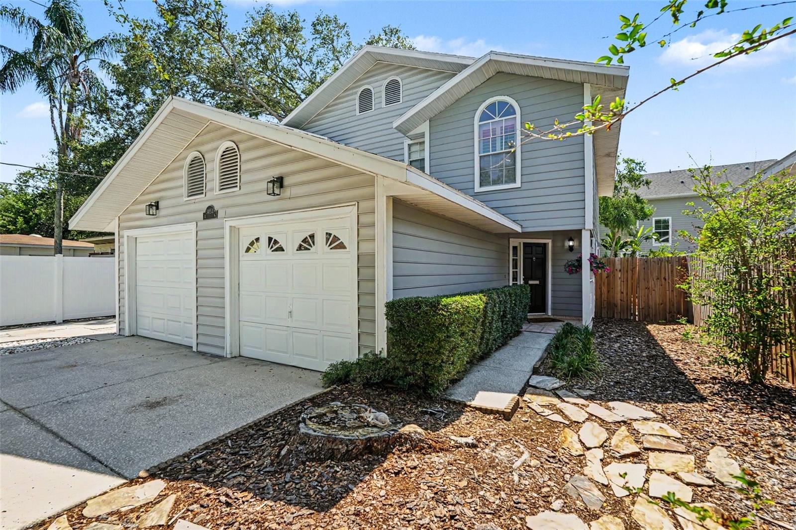 Your South Tampa oasis awaits in the heart of Palma Ceia, just five blocks from iconic Bayshore Boulevard. This beautifully maintained 2 bedroom, 3 bath townhome with a 1 car garage offers an incredible blend of charm, privacy, and everyday convenience, with no HOA, no CDD, and not located in a flood zone.

From the inviting front porch, step inside to a private foyer featuring wood-look LVP flooring, custom baseboards, and plantation shutters that continue throughout the home. The updated kitchen is both stylish and functional, offering granite countertops, a subway tile backsplash, updated appliances, and a convenient pass-through to the spacious living and dining area, perfect for entertaining or keeping the conversation flowing.

The main living space feels warm and welcoming, anchored by a beautiful built-in fireplace and flanked by two sets of French doors that open to a large screened porch and private fenced backyard. Shaded by mature trees, this outdoor retreat feels like a hidden escape in the city, ideal for morning coffee, evening wine, weekend grilling, or relaxing after a day on Bayshore.

Upstairs, you’ll find two generous bedroom suites, each with its own full bathroom. The spacious primary suite features double-door entry, custom crown molding, a large walk-in closet, and double windows with beautiful sunset views. The en-suite bath includes a dual-sink vanity with granite countertop, crown molding, and a custom glass shower door. The secondary suite offers plenty of space, a vaulted ceiling, great morning light from the east-facing window, a roomy closet, and an updated bath with granite countertop and a tub/shower combo with custom shower door.

Additional features include a new HVAC system installed in December 2024, fresh interior and exterior paint, a fully fenced backyard, 3M window film on east and west-facing windows and French doors, washer and dryer hookups in the clean single-car garage, and thoughtful updates throughout. Lovingly cared for and move-in ready, this Palma Ceia townhome places you just around the corner from boutiques, restaurants, shops, and the best of the South Tampa lifestyle.