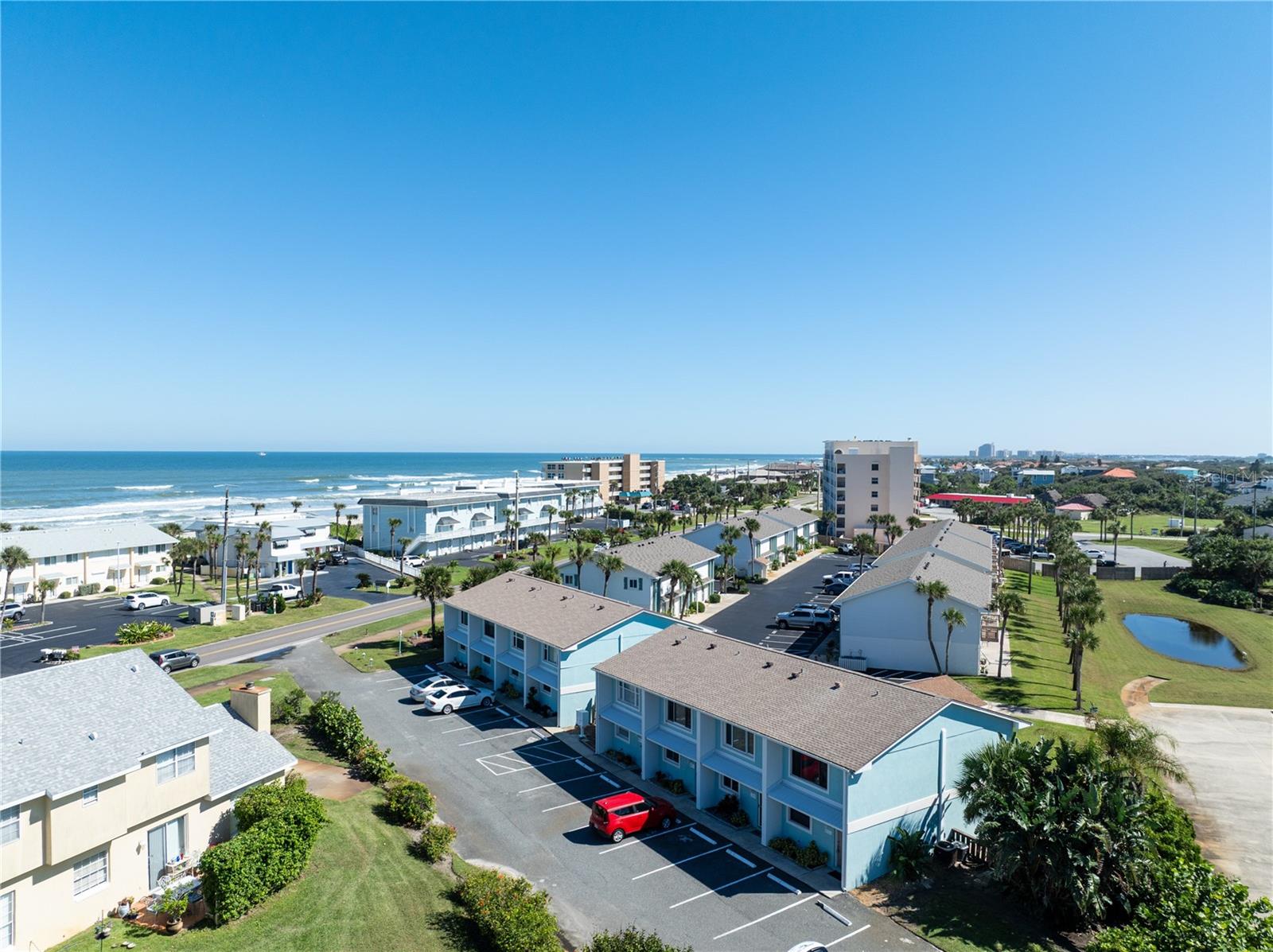 Your fabulous, secluded Beachside Retreat awaits! Right across from the beach, you can plan your day with easy access and comfort. Tucked away with an outside patio and Ocean Breezes, it's the ultimate fun to cook out, grill and entertain. Downstairs is the Kitchen, Dining and Living Room, and remodeled full bathroom. Both Bedrooms and Bath are upstairs. Close to all the Famous Restaurants with water views for your dining pleasure, and the Ponce Inlet Lighthouse! Racing's First Turn is close by too! You will occasionally bump into several Nascar Driver's who frequent the area restaurants as well. Boat Charters and rentals are all nearby. Bicycling and Beach walking are fun to stay active in this cozy little town. Don't miss seeing this gem of a home with some of the lowest HOA fees.