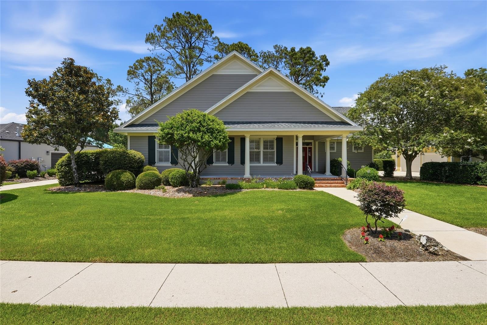 Nestled behind the gates of Savanna Pointe, this beautifully maintained 4-bedroom, 3-bathroom residence offers the perfect balance of comfort, privacy, and natural beauty—all just moments from the best of Gainesville. Built in 2003 by the McKinney Building Company, the home is situated on a lushly landscaped lot backing to protected conservation land, creating a peaceful setting with no rear neighbors and serene wooded views. Inside, the home features nearly 2,400 heated and cooled square feet and approximately 3,000 square feet under roof. The carefully designed three-way split floorplan provides both functionality and privacy, with pocket doors allowing each wing of the home to be separated from the central living space when desired. At the heart of the home, the thoughtfully-designed kitchen opens seamlessly to the main living area and is equipped with granite countertops, custom cabinetry, a gas cooktop with downdraft ventilation, and a large center island ideal for entertaining and everyday living. Large windows throughout the home fill the interior with natural light and enhance the open, inviting atmosphere. The great room extends effortlessly to a generously sized screened and covered lanai, offering the perfect place to enjoy morning coffee, evening sunsets, or simply relax while overlooking the tranquil conservation backdrop. Attention to detail is evidenced by upgrades found throughout the home, including recessed lighting, ceiling fans, and a professionally designed custom sound system installed by Sound Ideas. A spacious 2-car garage provides additional storage, while a Generac whole-home generator offers added convenience and peace of mind during Florida storm season. Savanna Pointe is one of Gainesville’s most sought-after gated communities, appreciated for its mature landscaping, quiet streets, and timeless architecture. The HOA includes landscape maintenance with a dedicated gardener, making for an easy, low-maintenance lifestyle, while the 24/7 locked gate adds an extra level of security. Bordering the breathtaking expanse of Paynes Prairie Preserve State Park, the neighborhood offers a rare connection to nature with sweeping prairie views, abundant wildlife, and endless opportunities for hiking, birdwatching, photography, and outdoor recreation. Despite its peaceful setting, the home remains conveniently close to UF Health Shands Hospital, the University of Florida, the VA Hospital, and the shopping, dining, and cultural attractions of downtown Gainesville. Whether you're looking to downsize or searching for a refined home that blends quality craftsmanship with a serene natural setting, this property offers an exceptional opportunity in one of Gainesville’s most distinctive communities. Recent updates include a new roof (2022) and water heater (April 2026).