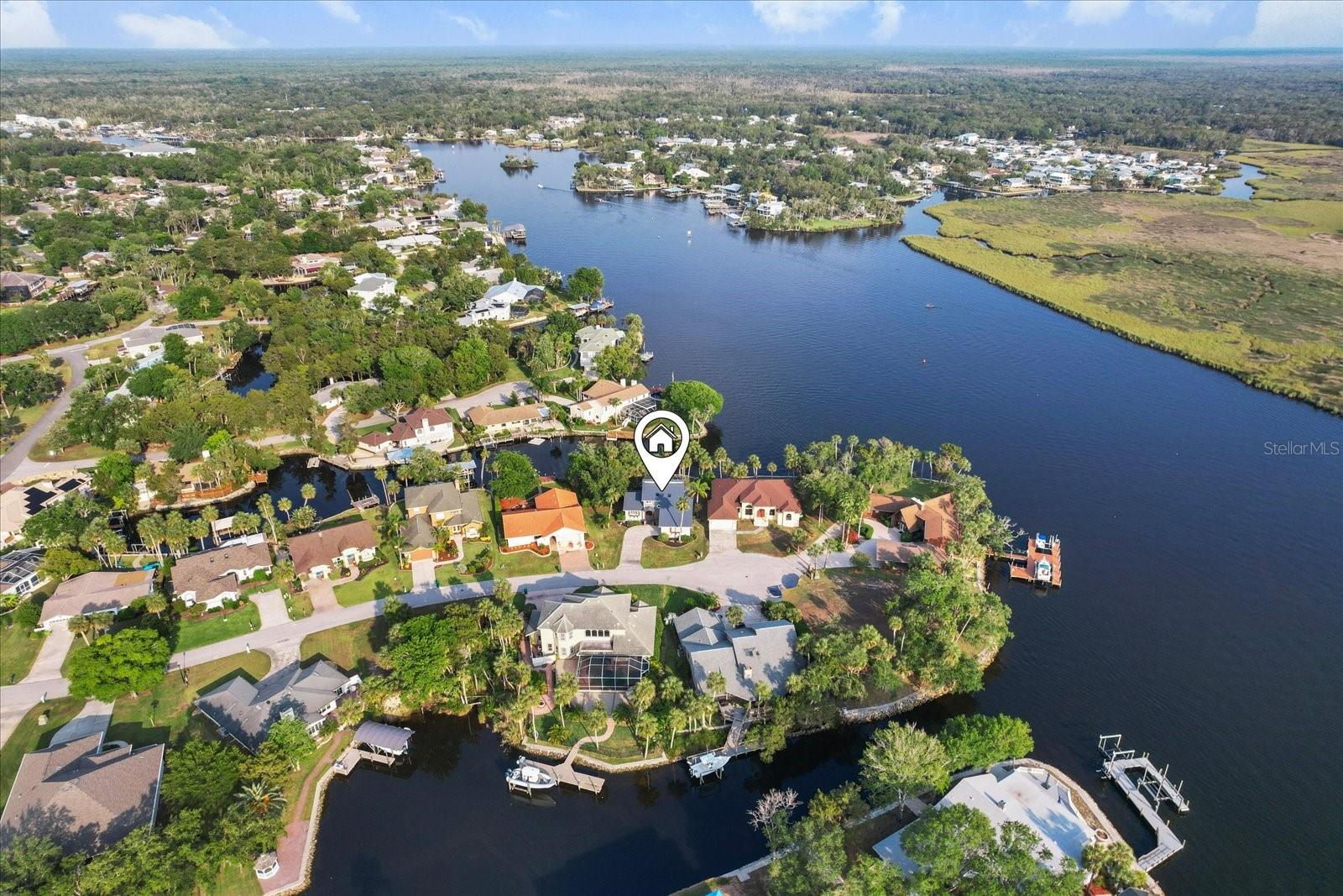 Here's your chance to live where others vacation! This gorgeous waterfront home in Riverhaven has the most spectacular views from every room w/ the expansive open floor plan and abundant natural light. With soaring high ceilings & coastal feel, this home offers modern comforts and style throughout. Located just at the edge of a scenic cul-de-sac with 105 ft of waterfront views of the Homosassa River. Elevated and majestic, the main living area DID NOT FLOOD w/Helene or Milton. This 3 bedroom, 2 bath home is offered FULLY FURNISHED and is turn-key ready. Entertain guests in the spacious living room that seamlessly flows into the kitchen, dining & sitting area, with floor to ceiling window views and sliding doors leading to an outdoor kitchen area. The large fenced in yard has a composite walkway leading to the dock & boat lift. New metal roof in 2024, new garage door 2025. Located in one of the most picturesque areas of Florida, this home is surrounded by natural beauty, with Homosassa Springs, Three Sisters Springs, Crystal River, and the Gulf of America just minutes away. Enjoy easy access to waterfront restaurants, shopping, marinas, & public boat ramps—everything you need to live the laid-back, Nature Coast lifestyle. Schedule your showing today and come see why Homosassa is one of Florida’s best-kept secrets!