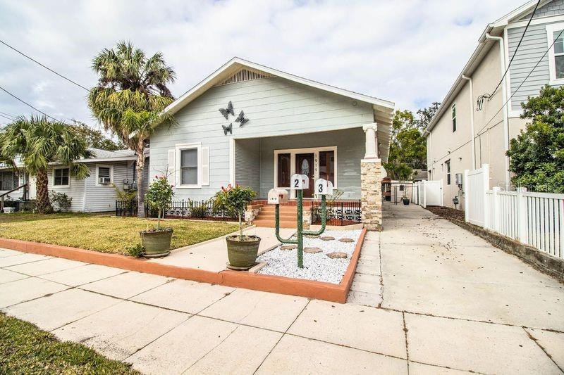 Price reduction and new pictures (showing furnishings) have been added. Location! Location! Location! Historic Hyde Park income property (with three units) convenient to Soho dining entertainment district, WalMart Neighborhood Mart, Buddy's Coffee Shop, and Ducky's. Downtown, Bayshore, and Old Hyde Park village are minutes away. The main house is a 2/2 with formal dining, living room, and large kitchen. There is an indoor laundry closet (washer and dryer included). The main house has rear screened porch and rear patio. The 2 story building in the rear of property has two units. Unit 2 (downstairs) is a 1/1 with large rooms. Unit 3 (upstairs) is a 2/1. Units 2 and 3 share the 10 x 10 laundry room with washer and dryer (located downstairs). All tenants share the fenced courtyard and outdoor grill. Each unit has a storage shed. Courtyard is fenced. Dining room has gas fireplace. Attic access is a door in the hallway. Laminate flooring in house, tile in units 2 and 3. There is parking in the driveway and also ample street parking. Main house had new roof installed November 2024. Rear building with units 2 and 3 had roof installed 2021. Each unit has a separate electric meter. Units 2 and 3 share water meter (owner is currently paying water for unit 2 and 3 meter. Exterior lights on the home are LED motion sensor lights. House was tented for termites in 2022 (house only). Good for 7 years. Home was replumbed 2015. Home has the old main, but new plumbing (from city water meter to house is original plumbing). Home was rewired in 2010. Irrigation is connected to the main house water line which is metered to the main house. Windows in main home are double paned (20 windows) Seven windows are still original and have not been replaced. Seller has architectural (blueprint) drawing of a proposed townhouse on the property, if requested. Large mirror in dining room does not convey with sale. Upstairs unit 3 has been recently remodeled and is beautiful with new stainless steel appliances, Pergo flooring, new double pane windows, bath with walk-in shower, and new wall AC units. Unique LED lighting adds to the beauty of this cozy upstairs unit. The entire rear 2 story unit has been professionally treated for pests. There is additional parking by entering through a 13 foot electric gate (via the alley / rear entrance) using a remote or keypad. Note: Units 2 and 3 currently share an electric water heater and meter. They are plumbed separately and can be changed to their own water heater and meter if so desired. The main house was built in 1900. The 2 story apartment building was built in 1946.