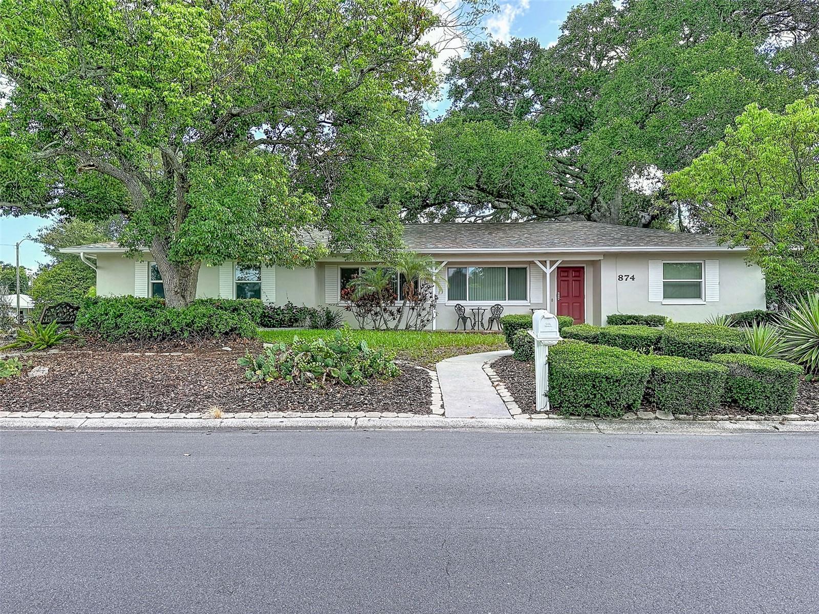 Welcome to this exceptional residence located in one of Dunedin's most desirable neighborhoods, just minutes from the vibrant downtown district, waterfront parks, boutique shopping, dining, and all the charm that has made Dunedin one of Florida's premier golf cart communities.
Ideally situated on a desirable corner lot and located in a Non-Flood zone and Non-Evacuation zone, this solid block-constructed home offers 4 bedrooms, 3 bathrooms, and 1,663 square feet of living space, with 2,261 total square feet under roof. Designed for both comfort and functionality, the home has been thoughtfully updated. Significant improvements include a complete home re-pipe completed around 2013, full PGT Impact-Rated windows and doors for enhanced storm protection, energy efficiency, and peace of mind, a new roof installed in 2020, a new HVAC system in 2023, and new vinyl fencing 2024. Adding an additional layer of security and convenience, the property is equipped with a newer Generac 22kW whole-home generator connected to an 800-gallon buried propane tank, providing reliable backup power when needed. The split 2-car garage configuration offers excellent flexibility for vehicle storage, a workshop, hobby space, or additional storage needs. With its exceptional location, extensive updates, and impressive infrastructure, this Dunedin gem presents a rare opportunity to experience the very best of Florida living.