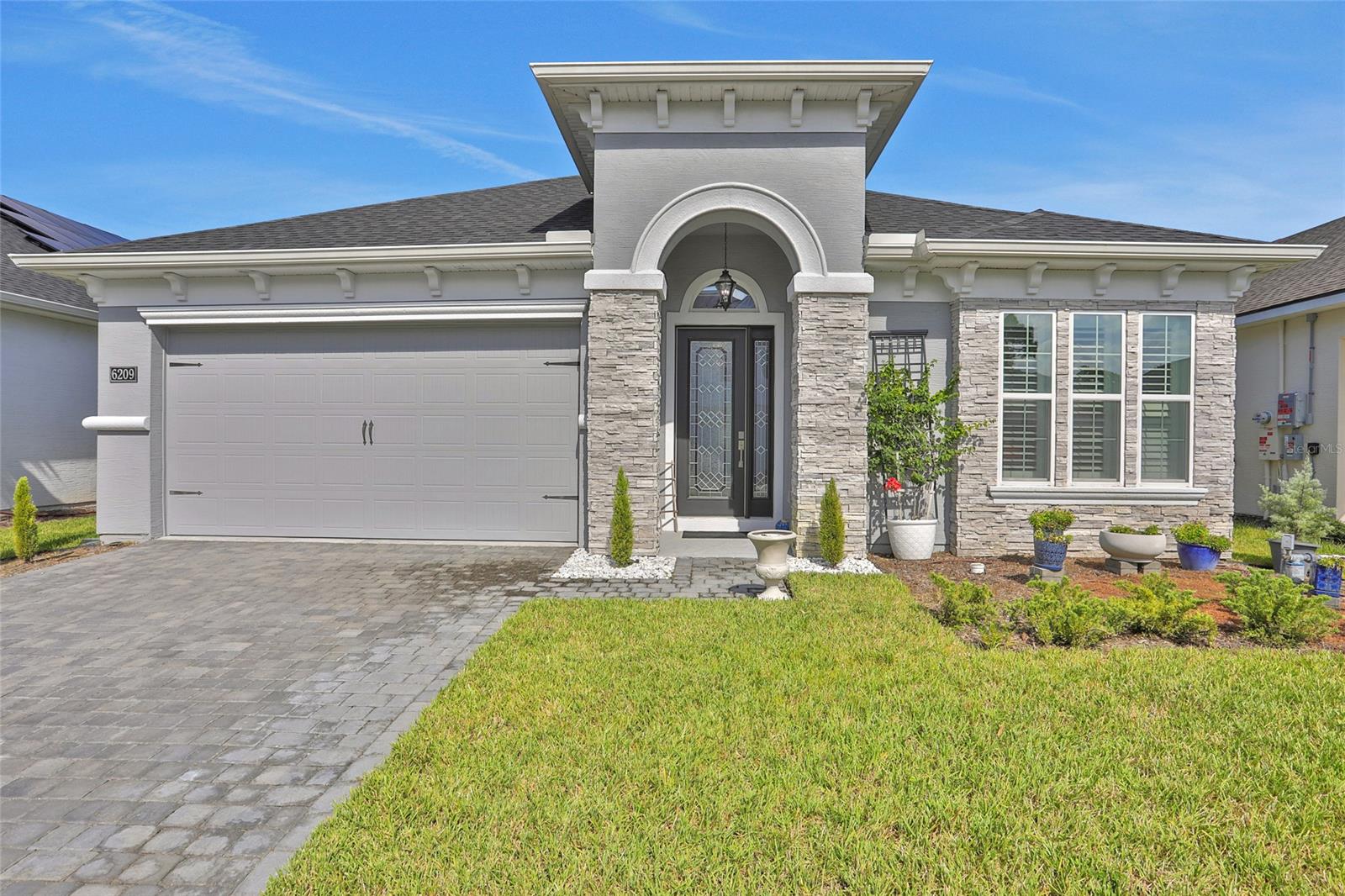 Welcome to your dream home in the charming Woodhaven neighborhood of Port Orange! This stunning craftsman-style elevation with a Serena floorplan, is a true gem offering a perfect blend of modern luxury and comfort. Boasting 4 bedrooms and 3 full bathrooms spread over 2,239 living square feet, this home provides ample space for your family's needs. Step inside and be greeted by the grandeur of 12' ceilings in the common areas, creating an open and airy atmosphere that's both inviting and spacious. The thoughtfully designed layout includes a den, allowing for a private home office or cozy reading nook - the choice is yours. The heart of this home is the exquisitely designed kitchen. The deluxe kitchen features quartz countertops, reverse osmosis water filter, built-in appliances,

and a cooktop, catering to your culinary ambitions.
Retreat to the enclosed lanai - a perfect spot to sip your morning coffee or unwind after a long day, overlooking your expansive backyard that opens up to the tranquil waterfront pond. Plantation shutters grace every window and for your peace of mind, a tamper alarm secures all windows, ensuring your family's safety.
The Woodhaven neighborhood is more than just a place to live - it's a community that embodies the spirit of Port Orange. The top-rated school district adds an extra layer of appeal for families and with neighborhood amenities such as a pool for those sunny Florida days and a security gate at the entrance, you'll experience comfort and peace of mind.
Don't miss the opportunity to experience the lifestyle and elegance this property offers. Schedule a showing today and envision yourself in this exquisite haven in Woodhaven! ;Water: City