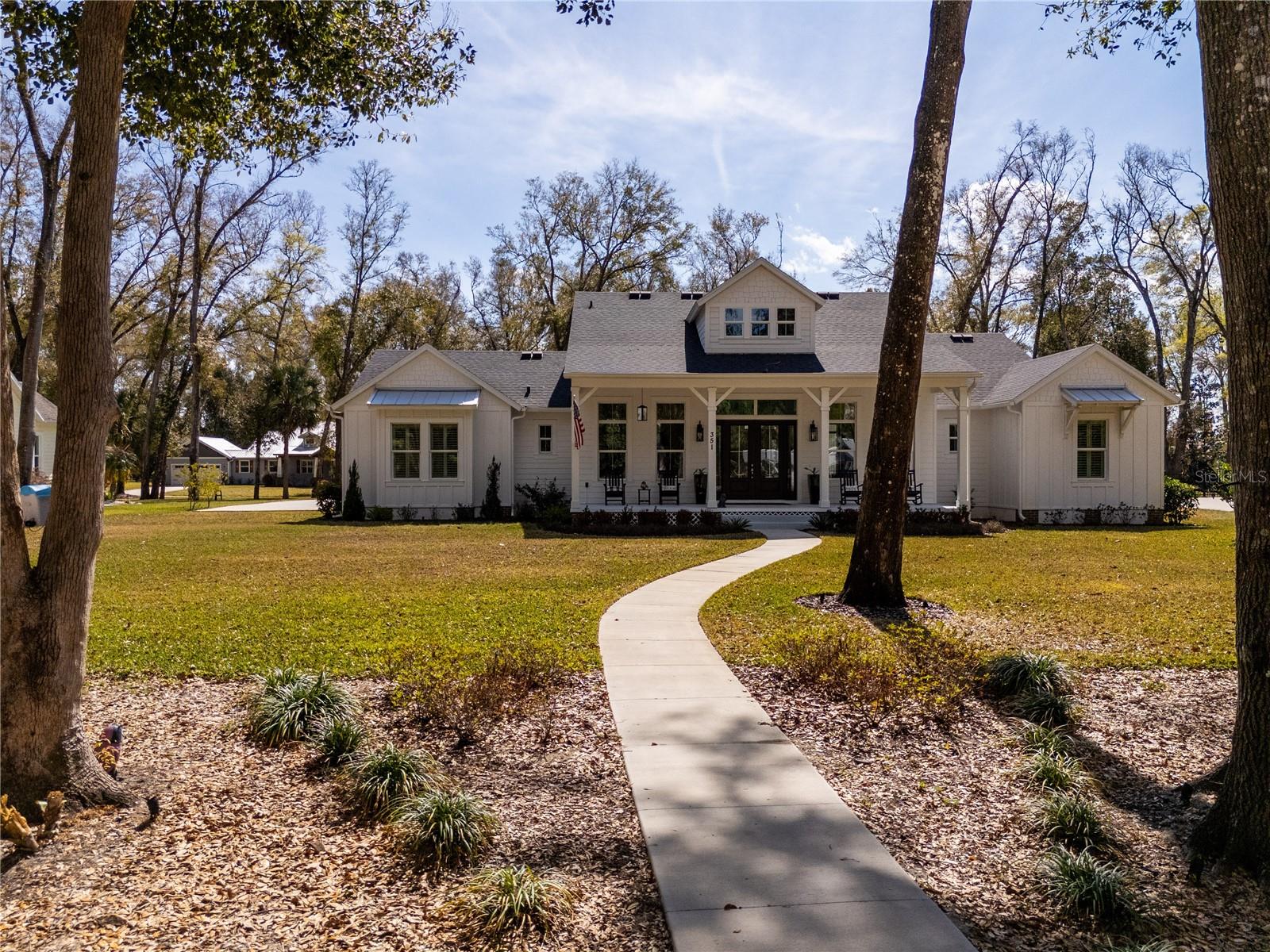 Discover charm and modern comfort at 351 W Main Street, Lake Helen, FL—your slice of small-town paradise just minutes from DeLand and Daytona Beach. This brand-new 2023 unique custom-built farmhouse offers a stunning open-concept layout featuring 4 bedrooms, 3½ bathrooms, and a dedicated office. Enjoy gleaming finishes, classic farmhouse design, oversized lot, tall windows, and soaring 12+ foot ceilings—ready for you to call home.
With 2,637 sqft of air-conditioned living space and 3,459 sqft under roof, this home provides both comfort and functionality. Enjoy the prime Main Street location within 2 minutes to local shops, cafés, Lake Helen, and parks, plus easy I-4 access for quick Orlando commutes (under 45 minutes).
The spacious lot offers plenty of room for a pool, garden, or play area—perfect for Florida living. Ideal for first-time buyers, growing families, or savvy investors in this up-and-coming Volusia County gem.
Schedule your showing today!