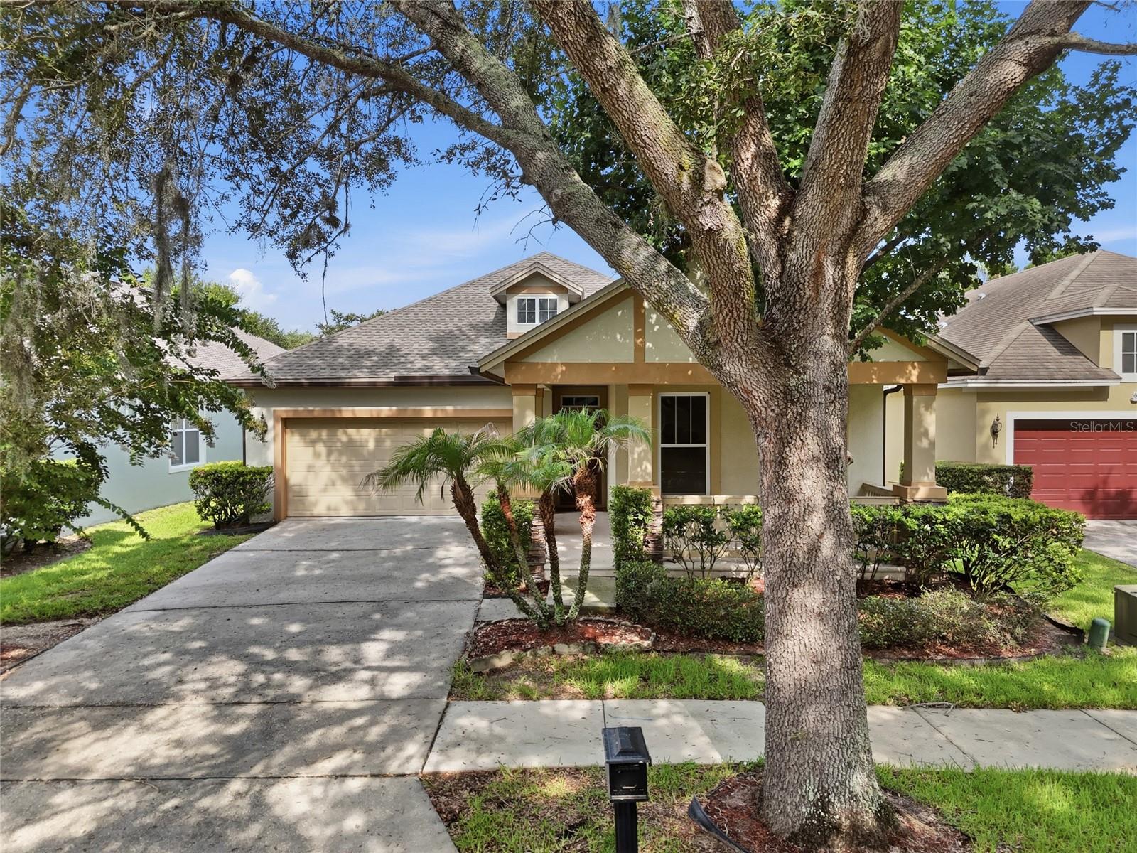 This charming 3/2 home in the heart of Windermere is sure to make you fall in love! The covered porch and walkway provide a serene entrance to the place you'll be proud to call home. Step inside and you'll find two cozy bedrooms with a bathroom in between, also conveniently located for guests. The hallway leads to a two car garage entrance and laundry room (equipped with newer GE washer and dryer) on the left and a large flex space on the right. This space, with bamboo floors, can serve as a formal living room and family room or a formal dining room and living room - the options are endless! Across from this space is the kitchen, which also has space next to it that can be used for dining or a home office. The kitchen has a GE cooktop with separate oven, two microwaves (one can be replaced with a hood), a new Samsung fridge (2025), and walk-in pantry. The master bathroom which is conveniently located off of the kitchen has a walk in closet (with a rotating shoe rack that holds 90+ pairs), extended shower, and separate toilet room. But wait, there's more! Enjoy a screened lanai that extends the width of the house, mango and avocado trees, easy access to the newest community center with pool, and a plethora of smart features! Other features you'll be excited about include a water softener system (2024) and privacy tints on all windows - which also helps with the Florida heat! Oh and did I mention that the sun rises in the front and sets in the back?! Fall sunsets on the covered lanai are a dream!