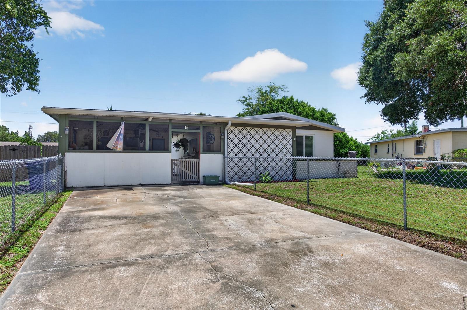 **Updated 2-Bedroom, 2-Bath Home with Major Improvements and Spacious Yard!**

Discover the perfect blend of charm and functionality in this beautifully maintained **2-bedroom, 2-bath home** in Daytona Beach. Featuring **beautiful hardwood floors**, **solid wood cabinetry**, and a warm, inviting layout, this home is ready for its next owner.

Recent updates provide peace of mind, including a **new roof (2023)**, **new septic tank and drainfield**, **new water heater (2025)**, and **A/C replaced in 2018**.

The oversized **screened-in bonus room** creates the perfect space for entertaining, relaxing, or enjoying Florida's year-round weather. A **separate utility/laundry room** offers additional storage and convenience.

Step outside to a **large backyard** with endless possibilities for gardening, pets, outdoor entertaining, or future additions.

Conveniently located with quick access to **I-95 and I-4**, this home makes commuting easy while placing you just minutes from the **Halifax River**, **Daytona Beach's world-famous beaches**, shopping, dining, parks, hospitals, and entertainment.

Whether you're looking for a **primary residence, vacation home, or investment property**, this move-in-ready home offers exceptional value with major system updates already completed. Don't miss your opportunity to own an affordable piece of the Florida lifestyle—schedule your private showing today!