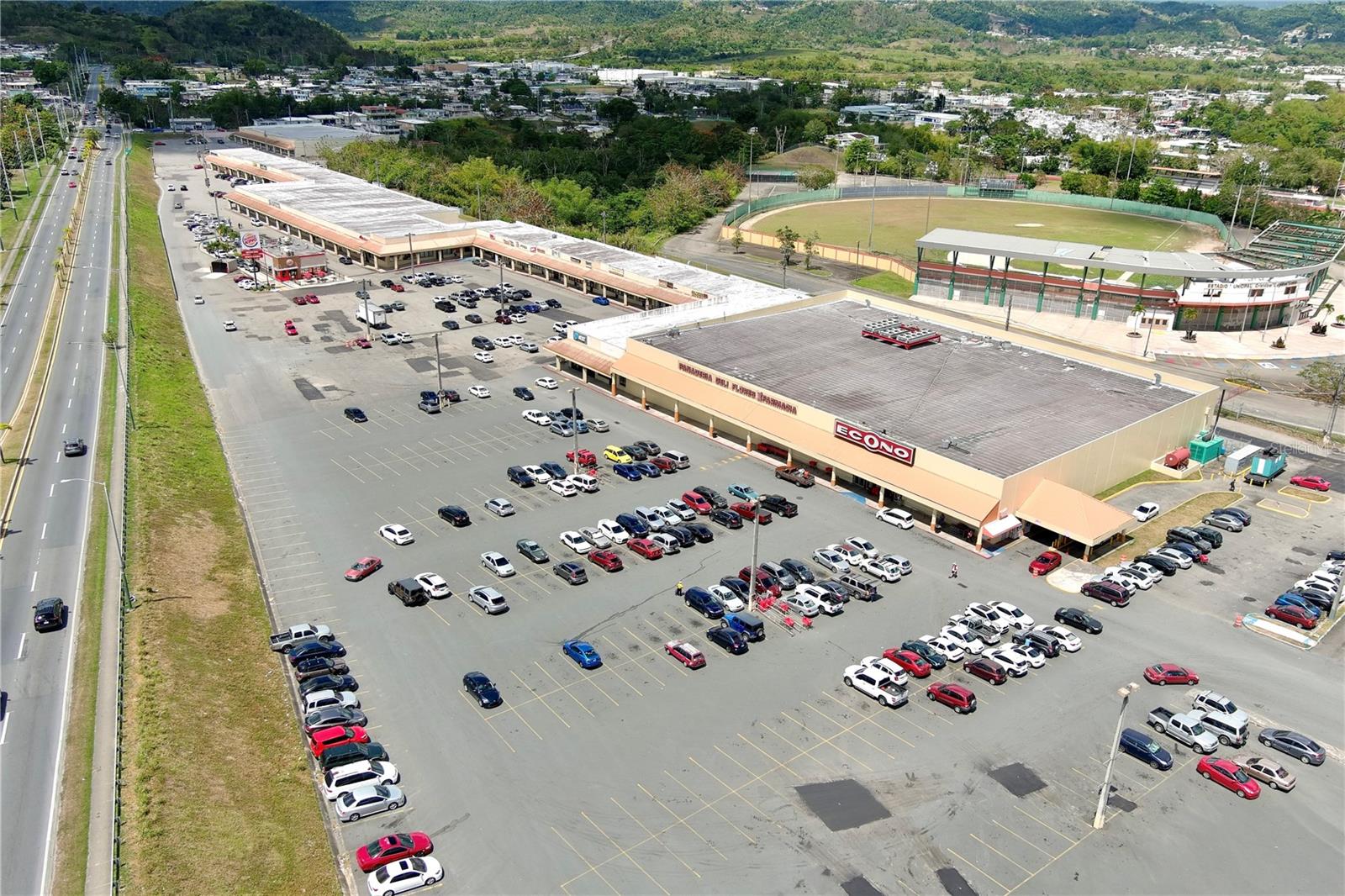 San Lorenzo Shopping Center – Prime Investment Opportunity.  Great opportunity to own the San Lorenzo Shopping Center, a premier commercial property in the vibrant and expanding community of San Lorenzo, Puerto Rico. With 147,813 square feet of rentable space, this property is anchored by the well-established Econo Supermarket and offers an occupancy rate of 69 percent, leaving room for growth. This is a rare opportunity for qualified buyers to unlock the center’s full potential by strategically enhancing the tenant mix with new businesses.

Located in a thriving local economy with a diverse range of businesses and a steady influx of new ventures, the San Lorenzo Shopping Center offers long-term value. The center’s current tenant mix is designed to meet the needs of the local community. In addition to Econo Supermarket, the property is home to popular retailers, chain restaurants, and essential service providers like National Lumber, Burger King, Subway, Liberty, Always 99, KFC, Triple S, Island Finance, Metro by PCS,  Claro, Lanco, Rainbow, Sabor Frappe and much more. This diverse lineup creates a one-stop destination for shoppers, generating consistent foot traffic and establishing the shopping center as a community hub. Situated with direct access to PR-183, the center’s prime location enhances its appeal. The strong performance of anchor tenants, combined with a dynamic blend of local businesses and national brands, adds both stability and growth potential to this unique investment.  NDA required by the principal prior to receiving financial information. Don’t miss this exceptional opportunity to invest in a bustling, high-demand location in the heart of San Lorenzo.