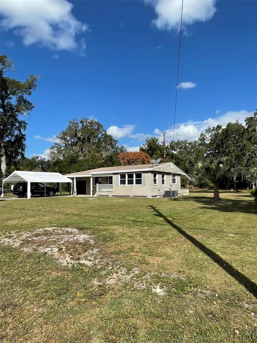 Newly renovated and move-in ready! This spacious three-bedroom, two-bathroom home in Orange City offers ample storage for all your toys, including boats, RVs, and trailers. Situated on a generous 0.69-acre lot, this property boasts no HOA restrictions. Enjoy the convenience of being just minutes from I-4.