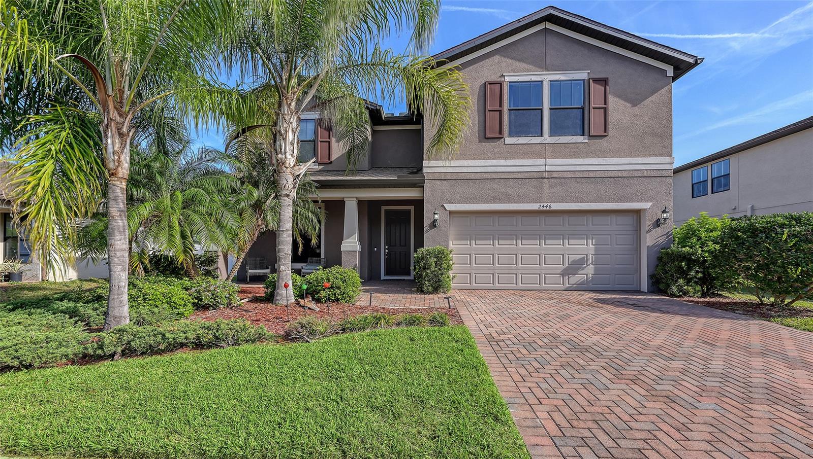 $20k PRICE IMPROVEMENT!!! Beautifully maintained two story 4 bed/2.5 bath home boasts 2,856 sq ft of indoor living space. This home features a 2-car garage, extended screened-in lanai, with occasional views of space shuttle launches. Updates include a new roof (2023), fresh carpet and paint (2024), and laminate floors in the office/den (2021). The home features matching cabinets and granite countertops throughout, a coffee bar area, custom lighting and ceiling fans, hurricane shutters, and an in-wall pest control system offering comfort, style, and peace of mind. The community features a pool, playground, and outdoor grilling/seating area, perfect for family fun and entertainment. Move in ready... all it needs is the next owner!!