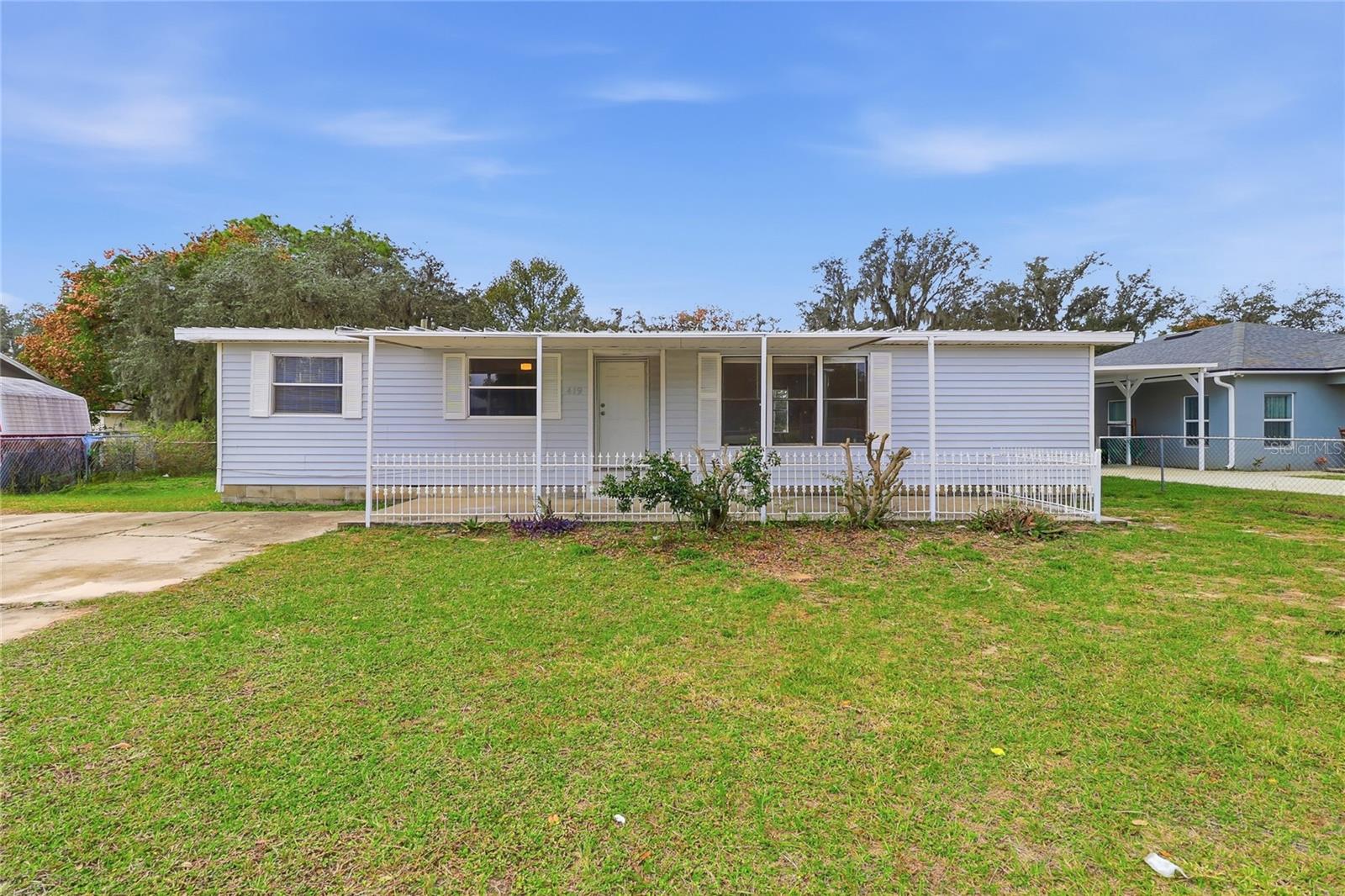 Price reduced! This property is best suited for cash buyers or those using hard money or alternative financing. Welcome to 419 Sunrise Boulevard--A charming home tucked right in the heart of Polk City! This beautiful 3-bedroom, 2-bathroom property sits on a fully fenced .24-acre lot and blends comfort, convenience, and potential all in one. Step inside and you’ll immediately notice the warm, welcoming layout, with brand-new luxury vinyl flooring, updated bathrooms, and a brand-new mini-split A/C system keeping everything cool and comfortable. The home offers a great sense of space with a separate living room, a dedicated dining area, and a covered front porch perfect for rocking chairs, plants, and peaceful mornings. Both bathrooms feature modern walk-in showers, and the primary suite includes its own private en-suite bathroom. Out back, the large fenced-in yard is ready for gatherings, gardening, pets, or outdoor living. The detached garage offers endless possibilities—use it as storage, finish it into a workshop, or explore converting it into a guest space or mother-in-law suite if allowed. It’s a great opportunity to add value and personalize the property even more. Located just off Highway 33, you’re minutes from I-4, local restaurants, shopping, and everyday conveniences. Polk City is growing and full of small-town charm, with access to great local lakes for fishing and enjoying the outdoors, community parks, and a welcoming atmosphere. This home is ideal for first-time home buyers or anyone looking to settle down or retire in a peaceful, convenient location. Come see why 419 Sunrise Boulevard is the perfect place to call home! Schedule a tour today!