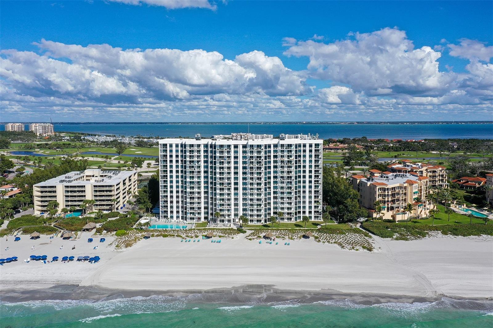 This is the gorgeous ground floor, walk-out unit next to the beach you've been looking for. Do you prefer to live like a single family home, no elevator, and walk straight out to the beach? Then this is the One! Welcome to Sea Gate Club on beautiful Longboat Key, perfectly positioned near mid-island, and close to shopping at Publix or CVS. As you enter this very private End Unit #1A, you're greeted by Direct and Unobstructed Gulf and beach views as far as the eye can see. Unit #1A has been extensively updated over the last few years, featuring an open kitchen with a huge island, updated cabinets and countertops, and gorgeous porcelain tile flooring. 350' of direct and private beach frontage! This unit is offered Turnkey-Fully Furnished with very tasteful furniture that you'll actually want to keep. Sea Gate Club condos are comprised of 89 units, spread across 15 floors. The building has been extensively updated over the past few years. Recent updates include a new pool and hot tub, new roof, newer hurricane rated windows, newer exterior stucco and paint, new elevator doors, climate-controlled bike storage, and paddleboard/kayak storage. Now is the perfect time to buy in this beautiful building, as there are NO current or pending assessments! Hurry before it's gone, this one is beautiful.
