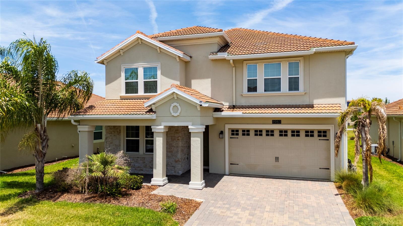 Welcome to your new home in Country Club at Champions Gate! This impressive residence offers approximately 3,800 square feet of living space on a 0.16-acre lot, combining space, elegance, and functionality in one of Central Florida’s most desirable communities. Featuring 5 bedrooms, 4.5 bathrooms, and a 3-car garage, this home is thoughtfully designed for both comfort and versatility. The open concept floor plan creates a bright and inviting atmosphere, perfect for everyday living and entertaining. One of the standout features of this home is its exceptional functionality, offering two primary suites one conveniently located on the first floor and a larger owner's suite on the second level plus two laundry rooms, one on each floor, providing added convenience for today's lifestyle.The kitchen serves as the heart of the home, featuring quartz countertops, a large center island, stainless steel appliances, and ample cabinetry, making it ideal for cooking, gathering, and entertaining.The spacious living areas flow seamlessly into the outdoor space, creating the perfect setting to relax, entertain guests, or design your own private outdoor retreat. Upstairs, in addition to the expansive primary suite, you'll find generously sized secondary bedrooms and flexible living areas that can easily serve as a loft, game room, media room, or home office. Located within a gated community, residents enjoy access to exceptional resort-style amenities, including a clubhouse with restaurant and bar, resort-style pools, a fully equipped fitness center, tennis and pickleball courts, recreational areas, golf access, and exclusive resident activities. Short-term rentals are not permitted, ensuring a more private and residential atmosphere. Ideally situated just minutes from major highways, shopping, dining, championship golf courses, and world-renowned attractions such as Walt Disney World, this home offers the perfect combination of convenience, comfort, and lifestyle. As an added incentive, the seller is offering $10,000 toward the buyer’s closing costs, providing valuable savings and making this exceptional opportunity even more attractive. Live where others vacation and experience the best of Champions Gate living. Schedule your private showing today and discover everything this remarkable home has to offer.