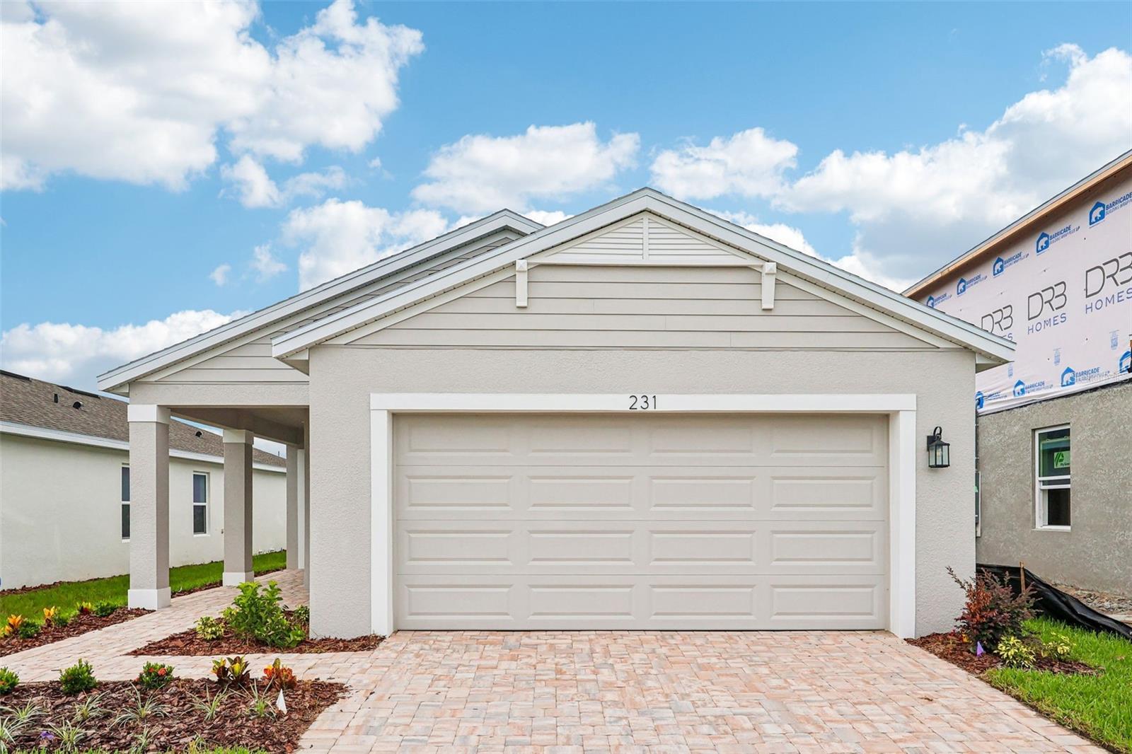 This beautifully designed 4-bedroom, 2-bath home features an open-concept layout with a spacious island kitchen overlooking the café and family room, plus a versatile flex space ideal for a home office, hobby room, or formal dining area. The private primary suite offers a large walk-in closet and an en-suite bath, while the secondary bedrooms are conveniently located near a full bath with dual sinks. Enjoy added privacy with no rear neighbors. This energy-efficient home also features modern finishes, stainless steel appliances, and thoughtful design throughout.