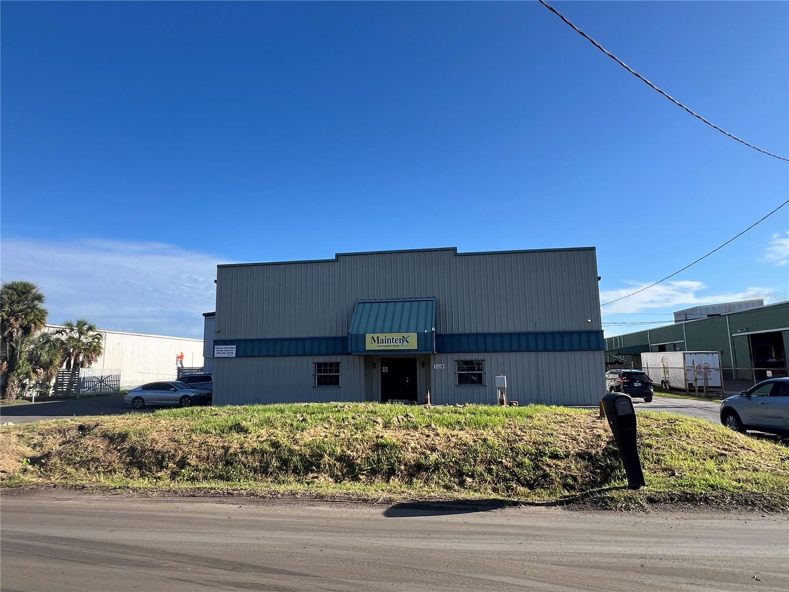This Palm River / Claire-Mel Manufacturing (M) zoned industrial site is 2.14 acres and consists of two warehouse buildings totaling 51,599 SF inclusive of approximately 9,966 SF of working and partially enclosed canopy area. The main structure is a 40,069 SF warehouse with 19-21 ft clear height, multiple roll-up doors along the rear and sides of the main structure, and contains approximately 3,852 SF of air conditioned 2 story office space renovated in 2017. The rear structure, currently serving as a metal shop, is an 11,530 SF industrial warehouse with 14-16 Ft clear height. The incoming power service to the site is 3 phase (208v – 600 amp).  There’s a transfer switch panel for generator power and 240-volt systems that include one 400-amp main breaker panel and two 200-amp panels. The site has access from both the East and West side of the main structure offering full turn access through the central concrete loading yard or can serve as additional lay down open storage area. The property has easy access to the Port and immediate service to Tampa, Brandon, South County, and Sarasota/Bradenton markets. 

*Seller currently occupies property and will require 60 days to vacate, post closing.

Located just east of S. 50th Street / US 41 near the intersection of Causeway Blvd.