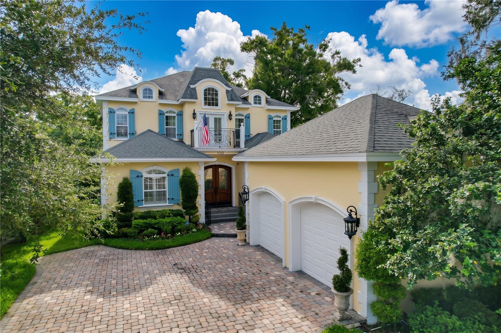 A rare opportunity to own a French Country estate on the Hillsborough River
Old world charm, new world amenities. Wake up to river views, end the day at your private dock — this is riverfront living, redefined. This exceptional French Country estate offers a extraordinary opportunity rarely found in Tampa: direct Hillsborough River frontage on a premium street in Historic Riverside Heights, just minutes from Downtown Tampa, the Riverwalk, Armature Works, and Tampa International Airport.
This is waterfront access most homeowners only dream about. From your private dock, it's roughly 20 minutes by boat to the heart of Tampa Bay and 45 minutes to open Gulf waters. A 50-foot concrete dock with a 16,000 lb. lift accommodates a 30–35 foot vessel, and a concrete boat ramp — grandfathered in and no longer permitted for new construction along the river — makes this property a true rarity for Hillsborough River access. From the water to the wraparound outdoor living spaces, this home was designed to be lived in alongside the river, not just near it.
Step inside to discover authentic French Country architecture elevated with thoughtful, modern updates. Nail-down oak wood plank flooring, crown molding, and oversized solid-core doors run throughout, while three newer A/C systems (2023), a leaf-filter gutter system, and a whole-home WiFi network bring old-world charm fully into modern convenience.
The first floor offers a private primary suite with a double closet, en suite bath, and French doors opening directly to the expansive walkout balcony — an old-world-scaled, French Country-style outdoor room perfect for morning coffee, entertaining, or grilling, all while overlooking the river. A beer and wine cooler pantry and surround sound spanning both floors complete the entertaining experience.
Upstairs, four additional bedrooms include a Jack-and-Jill bathroom suite, along with access to a second balcony offering breathtaking river views from two bedrooms and the hallway. A 700 sq. ft. climate-controlled basement adds a private office and substantial additional storage — a true rarity in Tampa construction.
Additional features include functional hurricane shutters (not decorative — fully operational), a Sub-Zero refrigerator, four irrigation zones front and back with a dedicated well pump, and a sump pump for the basement that has never been needed.
This is more than a home — it's a legacy property on one of Tampa's most coveted streets, offering the lifestyle, access, and architectural character that simply cannot be replicated.