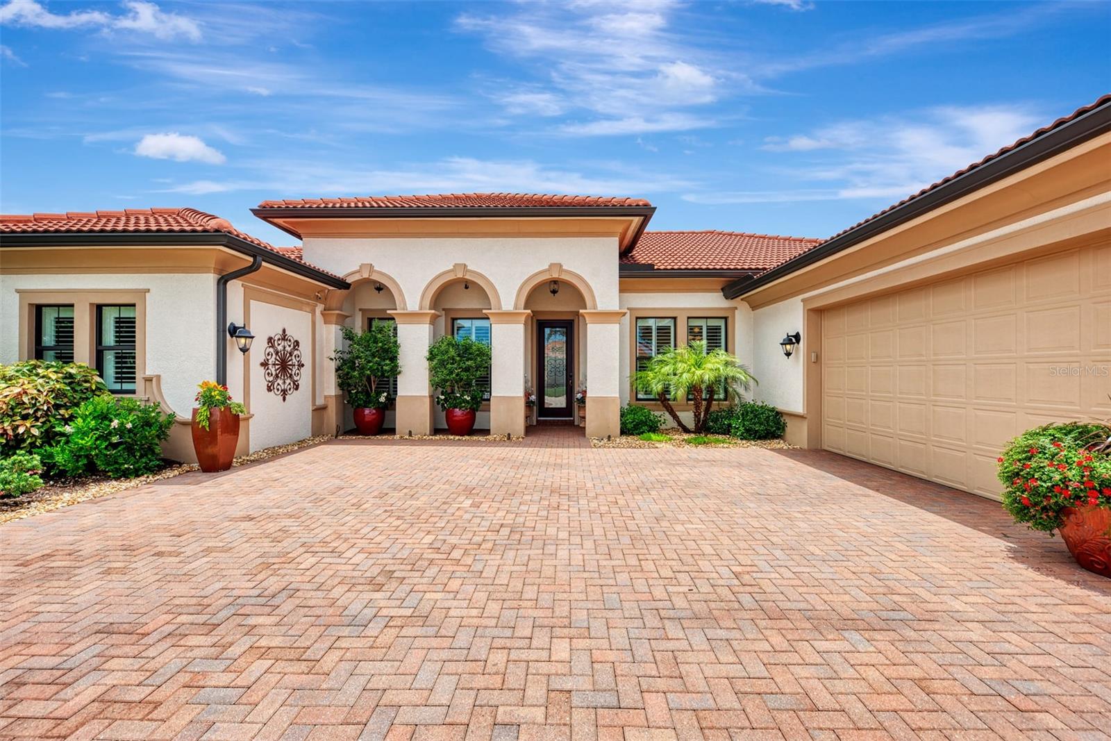 WELCOME to 10965 Bullrush Drive, a breathtaking WCI Pinehurst home located in the highly sought-after community of Sarasota National. With 3,611 sq. ft. under air, this is likely the largest home in the community. The property boasts a sprawling 65-foot-wide lanai, perfect for soaking in the serene surroundings of water, golf, and nature. This magnificent residence, being sold furnished,  offers three spacious bedrooms, three luxurious baths, and a 3+ car garage spanning over 700 sq. ft. Additionally, the home includes two full golf memberships at a Troon Prive' managed golf course. This home was just appraised for $1,509,000. On market under appraised value. The interior exudes elegance and comfort, featuring a separate dining room, a dinette off the kitchen with custom-built benches and cushions, and a private master retreat. The master suite spans over 400 sq. ft. and includes two 10' x 11' walk-in closets. A 10' x 12' master retreat off the primary bedroom provides a perfect place to relax with a morning coffee or a glass of wine at sunset. Guests and family will appreciate the additional bedrooms and baths located on the opposite side of the home, ensuring complete privacy. Enhancing the home's appeal are numerous upgrades, including a whole-house generator, a whole-house water-softening system, handmade curved wood arches in every doorway, an elegant beamed ceiling, and double crown molding throughout. The great room has been updated with a stunning stone wall, floating shelves, and custom cabinets, brightening the significant open space. Outside, meticulous care is evident with wood-paneled lanai ceilings, a waterfall, sundeck, and custom outdoor kitchen, creating a resort-like living experience. Every detail in this luxurious home has been meticulously attended to, leaving nothing to be desired. Troon is the largest provider of club management services in the world, and their services are included in your HOA fee with no upfront payouts or equity fees. You automatically become a golf member when you purchase a home in the golf community of Sarasota National, which is rated as one of the top golf courses in the area. Sarasota National, a Silver Certified Audubon community, spans over 1,200 acres dedicated to preserving the environment. This certification ensures that the community adheres to the highest standards of sustainable living, with a strong focus on conserving natural habitats and promoting biodiversity. The 30,000 sq. ft. amenity center offers a wealth of activities, including a pool, lap pool, spa, tennis courts, pickleball, bocce, golf, a library, coffee shop, and a Rainbow brand play center for the little ones in your life. Beyond the home’s exquisite features, the community provides an unparalleled lifestyle. Enjoy morning coffee at the café, leisurely reads in the library, rejuvenating spa sessions, and workouts at the 7,000 sq. ft. state-of-the-art fitness center. Families thrive in this vibrant community, making the most of amenities like the spa pool, bocce, tennis, and pickleball courts. Welcome to Sarasota National, where luxury and leisure await at every turn. Make this stunning home yours and embrace a life of unparalleled sophistication and comfort. The home is being sold semi-furnished. A $5,000 Capital Contribution to Sarasota National is required at closing.