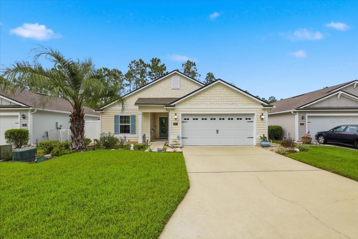Welcome to easy living in the highly desirable 55+ gated community of Grand Reserve, where homes in this exclusive gated section rarely become available! Tucked away on a quiet cul-de-sac within its own private gated enclave of just 50 homes, this beautifully upgraded 2020 smart-home-enabled home offers exceptional privacy, comfort, and value.  Seller must relocate, creating an incredible opportunity for the next owner — their loss is your gain! Packed with thousands of dollars in upgrades, this move-in ready home is priced to sell.  Step inside and immediately appreciate the bright open floor plan, soaring ceilings, and gorgeous wood-look tile flooring throughout the main living areas. Featuring 3 bedrooms and 2 bathrooms, the layout is ideal for both relaxing and entertaining.   The upgraded kitchen is the heart of the home with granite countertops, abundant cabinetry, oversized pantry, large center island, and natural gas stove all overlooking the spacious living and dining areas. The primary suite offers a peaceful retreat with a walk-in shower, double vanity, and generous closet space.   Enjoy your morning coffee from the screened lanai overlooking a private preserve with no rear neighbors. The backyard has been thoughtfully upgraded with fencing while still preserving the beautiful natural views and peaceful setting. Additional upgrades include a tankless water heater, water softener, irrigation system, gutters, and more.   Residents enjoy resort-style amenities including an Olympic-size pool, fitness center, pickleball, bocce courts, scenic walking paths, fire pit, outdoor gathering areas, golf-cart-friendly streets, and a very active social calendar. Conveniently located near shopping, restaurants, medical facilities, coffee shops, and just minutes to Flagler Beach.   Beautifully upgraded, exceptionally private, and located within one of the area’s most sought-after 55+ gated communities — this is a rare opportunity you do not want to miss!