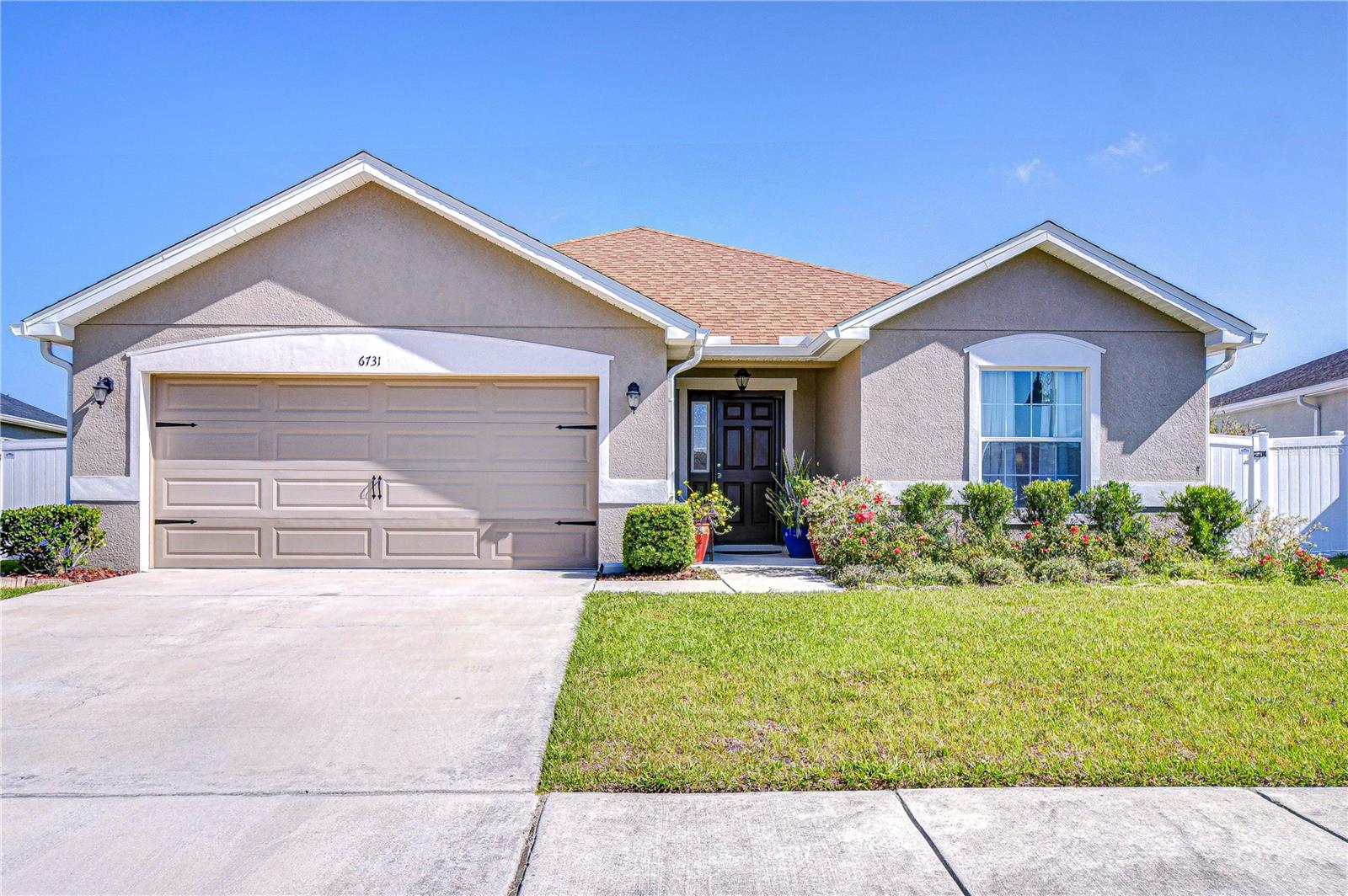 Come enjoy this craftsman style home with 2005 square feet of living space, with 3 bedrooms, a den that can be used as a bedroom, and 2 bathrooms, providing plenty of room for comfortable living. The wide entryway leads you to where you will be immediately drawn to the open concept design that easily connects the kitchen, dining, and living areas. This gorgeous kitchen has plenty of cabinets, QUARTZ COUNTERTOPS, and STAINLESS-STEEL APPLIANCES, and a GIGANTIC ISLAND for additional seating. A HUGE 6 x 8 pantry is a dream come true. There is NO CARPET in this home as the floors throughout the main living areas, bedrooms & baths are LUXURY WATERPROOF VINYL PLANK adding elegance and durability to the home. The spacious living room is perfect for enjoying get-togethers and has plenty of room for everyone. The master bedroom with its coved ceiling is situated at the rear of the home & offers 2 closets & a pocket door leading into the master bath. Two additional bedrooms share a sparkling full bath with tub/shower combo with ceramic tile enclosure, Silestone counters & dual sinks!! The Chapel Creek Communities boast resort-style amenities including a zero entry pool, cabana, dog park, playground, and scenic walking trails with fitness stations. Such a great location conveniently located with quick access to U.S. HWY 301, I-75, SR 54 and SR 56, the small town quaintness of Zephyrhills and Dade City plus the business and shopping of Tampa Premium Outlets and Wiregrass Mall. All within a reasonable drive