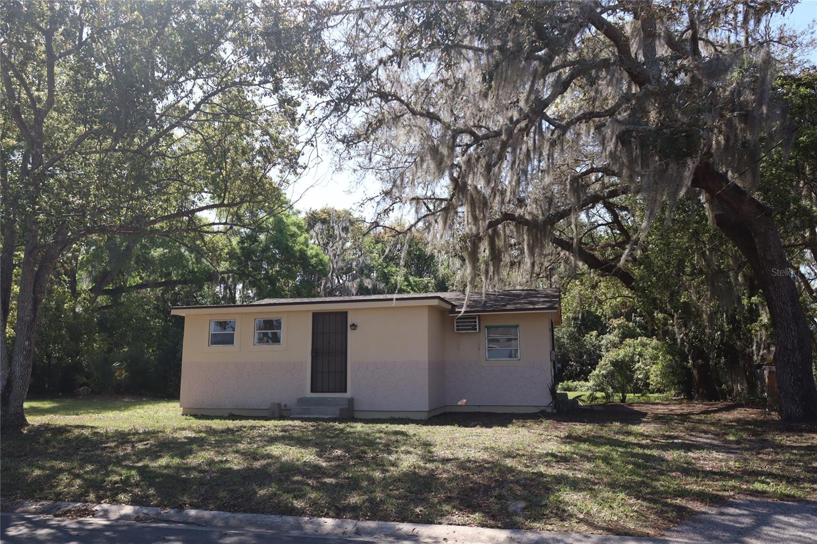 Cozy cottage-style home tucked away on a quiet cul-de-sac in Eustis. This place sits on a spacious .3-acre lot with plenty of room to enjoy the outdoors, shaded by mature trees that give it a peaceful, laid-back feel. The home itself is 801 sqf with 1 bedroom and 1 bathroom, plus a bonus room that has its own separate entrance—perfect for a home office, guest space, or hobby room. There’s also a separate storage room for extra convenience, along with a shed in the backyard for additional storage. Inside, you’ll find luxury vinyl flooring throughout, making it easy to maintain and giving the home a clean, updated look.
The neighborhood has a local, community-driven vibe—quiet, not a lot of traffic, and just an overall comfortable place to live.
If you’re looking for something simple, private, and with a bit of character, this could be a great fit.