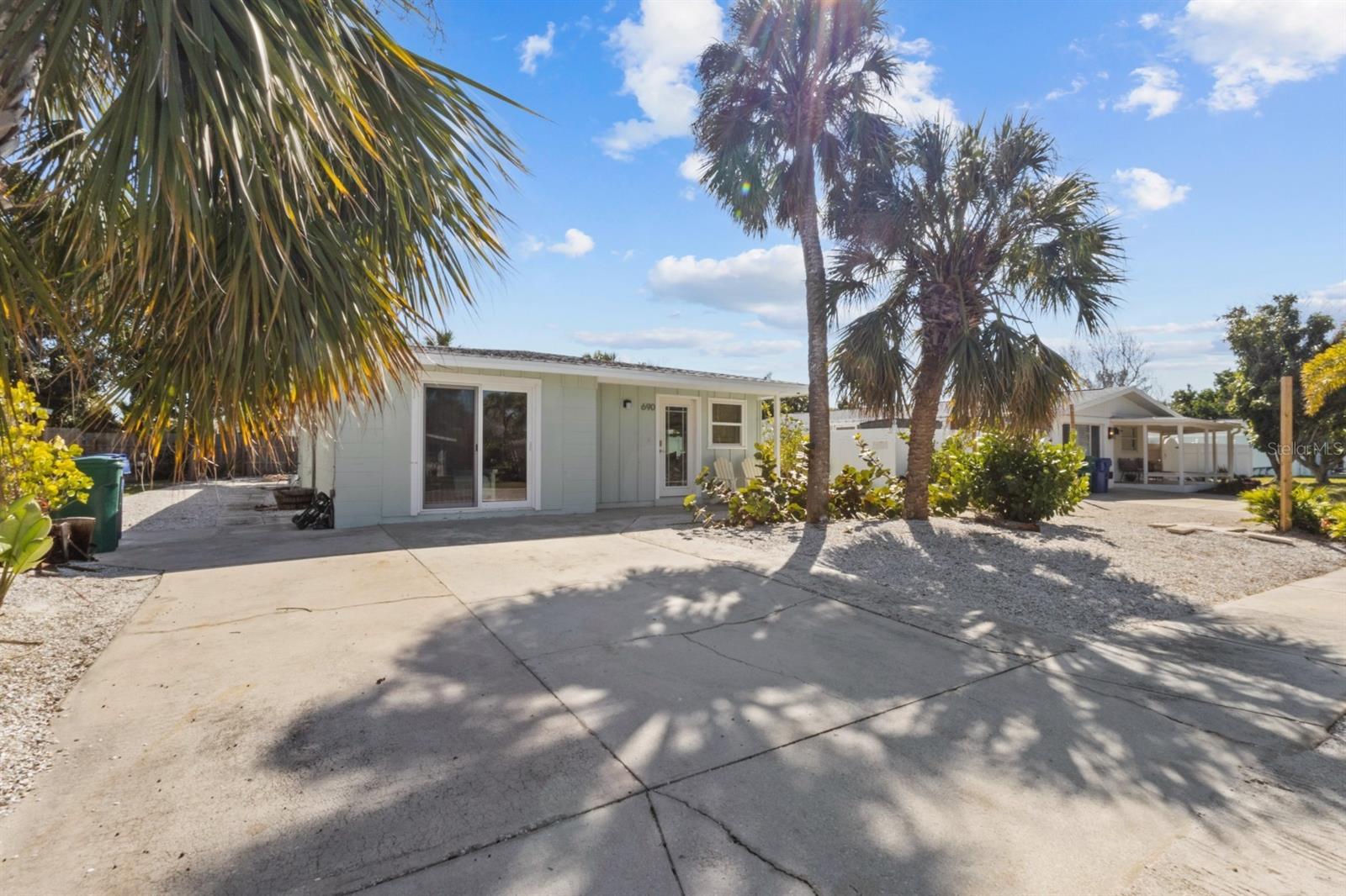 Buy the beach house, now is your opportunity! New unbelievable price on this fully renovated and turn-key furnished Village of Longboat Key Home. Take Advantage Today. Brand new Roof, New Hurricane glass throughout, Full interior renovation with new furnishings, Block home on a Beautiful private lot with outdoor living space and room for a Pool, steps away from white sand and turquoise water, rent-ability with the seller averages $55,000 a year in gross rental income while still enjoying personal use. Buy this property at an unbelievable price, rent it when you're not using it, and enjoy it for decades to come.
Coastal Elegance Meets Island Ease in Longboat Key's Coveted Village. Discover a sanctuary of sophistication at the exclusive North Tip of Longboat Key. Located in the heart of historic Long Beach Village, this is more than a home; it's the ultimate island lifestyle, delivered. Just a short, serene stroll separates you from the pristine beach and the island's best waterside dining. This property has been meticulously and fully remodeled, representing a rare "move-in ready" opportunity where every detail has been elevated. From top to bottom, inside and out, virtually nothing has been untouched. A Home Designed for Seamless Living: Open Concept: Step into an airy, open-plan great room, anchored by a brand-new kitchen - perfect for hosting intimate gatherings or unwinding after a day on the water. Chef's Delight: The remodeled kitchen is a masterpiece featuring stunning marble countertops, custom cabinetry, all-new luxury appliances (including a mini wine refrigerator), and a chic island/bar. High-End Finishes: Enjoy the cohesive flow of new luxury vinyl plank flooring throughout every room, complemented by fresh, designer-selected interior paint. Peace of Mind: Recently installed, all new windows and sliding glass doors are Miami-Dade impact resistant, offering superior protection and efficiency. Also a brand new architectural three-tab shingle roof was just installed. Your Private Island Retreat: Spa-Inspired Baths: Both the master and second bathrooms have been fully renovated with premium stone shower flooring, elegant new tiles, and updated fixtures. Outdoor Oasis: Off the master suite, a new impact-resistant glass door opens to a spacious, private backyard. The highlight is the expansive, screened-in porch that wraps around the back of the house, overlooking a charming outdoor fire pit and grilling area. Beach Ready: An exterior shower and dedicated storage for your gear make rinsing off after a day at the beach effortless. The Village Lifestyle: To know The Village is to fall in love with its relaxed, yet refined rhythm. This community places everything you desire at your fingertips: secluded walking trails, Bay access, community docks, and the island's best beach access. The Village is one of the few places on Longboat Key where the golf cart isn't just legal, it's the preferred, fun, and convenient way to live. Come and see it today.