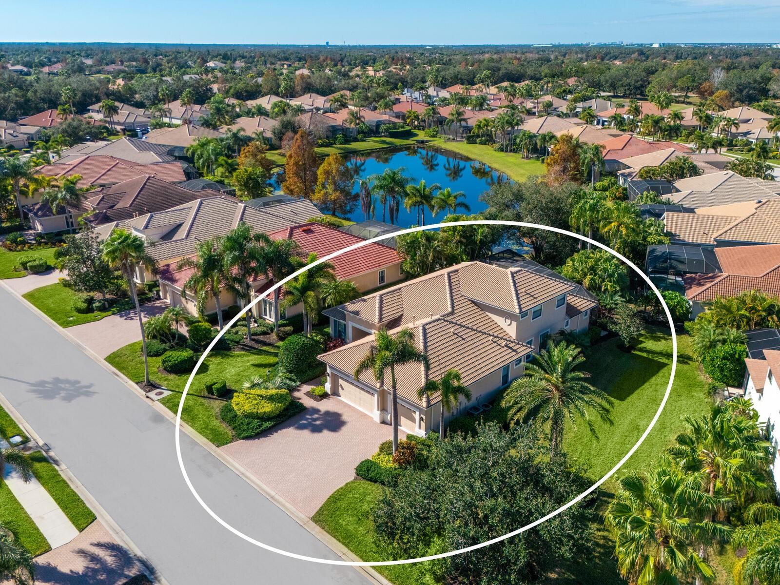 Virtually Staged. Step into a home that feels brand new. Recently refreshed and move-in ready, this exceptional Neal custom residence behind the gates of Lakewood Ranch Country Club now showcases a crisp, modern aesthetic with a freshly painted interior and all-new carpeting in the bedrooms and bonus/media room—creating a light, bright, and inviting palette that today’s buyers are seeking.
Perfectly positioned on a serene lakefront homesite, this 3,216 sq. ft. residence offers 3–4 bedrooms, 3.5 baths, a private media room, and an oversized three-car garage, blending timeless design with today’s updates. From the moment you enter, you’ll appreciate the elegant architectural details including coffered ceilings, crown moldings, and rich wood cabinetry—all beautifully complemented by the home’s fresh new look.
The gourmet kitchen is both stylish and functional, featuring quartz countertops, a custom backsplash, stainless steel appliances including an Advantium microwave and Samsung refrigerator, and a reimagined island with chair-height seating, pop-up wireless charging, and under-cabinet LED lighting.
The spacious primary suite offers a peaceful retreat with French doors to the lanai, customized closets, and a spa-inspired bath with Jacuzzi tub, bidet, and dual vanities. A dedicated office with double French doors provides an ideal work-from-home space, while the upstairs media room is designed for entertaining with a wet bar, beverage refrigerator, and a full home theater system with projector, 98” screen, and surround sound—all enhanced by brand-new carpeting.
Outdoor living is equally impressive, featuring a disappearing-edge PebbleTec heated pool and spa, outdoor kitchen with granite countertops, and tranquil lake views—perfect for enjoying Florida’s year-round lifestyle.
Recent improvements include new A/C (2024), new pool heater (2023), and the just-completed interior refresh, offering buyers peace of mind and immediate enjoyment.
Located within Lakewood Ranch, residents enjoy access to premier golf, tennis, fitness, dining, and the vibrant Main Street and Waterside districts.
Freshly updated, impeccably maintained, and now better than ever—this is your opportunity to own a truly move-in ready home in one of the area’s most sought-after communities.