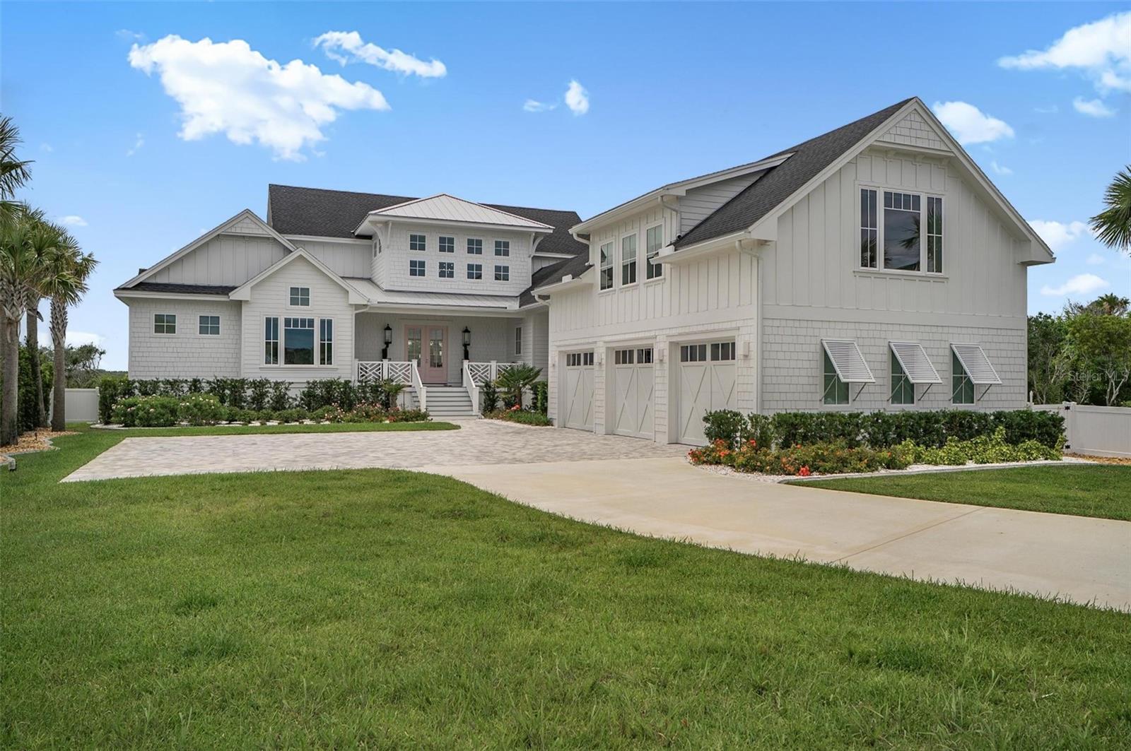 Experience exceptional waterfront living at 8065 A1A South, a private Intracoastal estate set on more than an acre just minutes from Historic Downtown St. Augustine. Soaring ceilings, designer finishes, statement Visual Comfort lighting, and walls of glass frame breathtaking water views, spectacular sunsets, abundant birdlife, and sailboats gliding by.

Designed for effortless indoor-outdoor living, the resort-inspired grounds feature a heated saltwater pool and spa, summer kitchen, pool bath, expansive lawn, and a palm-lined pickleball court with covered pavilion, all surrounded by lush tropical landscaping. The chef’s kitchen is equipped with JennAir column refrigeration, a professional-grade gas range, double ovens, an oversized island, wet bar, and a fully equipped butler’s pantry.

The primary suite occupies its own secluded retreat, featuring vaulted ceilings, a waterfront lounge, a spa-inspired bath, a boutique-style dressing room, and private laundry. Beyond the suite, the property boasts a complete luxury one bedroom apartment!

Built with comfort and peace of mind, the home includes impact windows, a whole-house Generac, underground sump pump system, irrigation well, and Shellock permeable pavers. Perfectly positioned in Cresent Beach, with easy access to pristine beaches, boating, fishing, kayaking, and paddleboarding, this remarkable estate blends elegant design with the natural beauty of Florida’s coast, creating an extraordinary waterfront lifestyle.