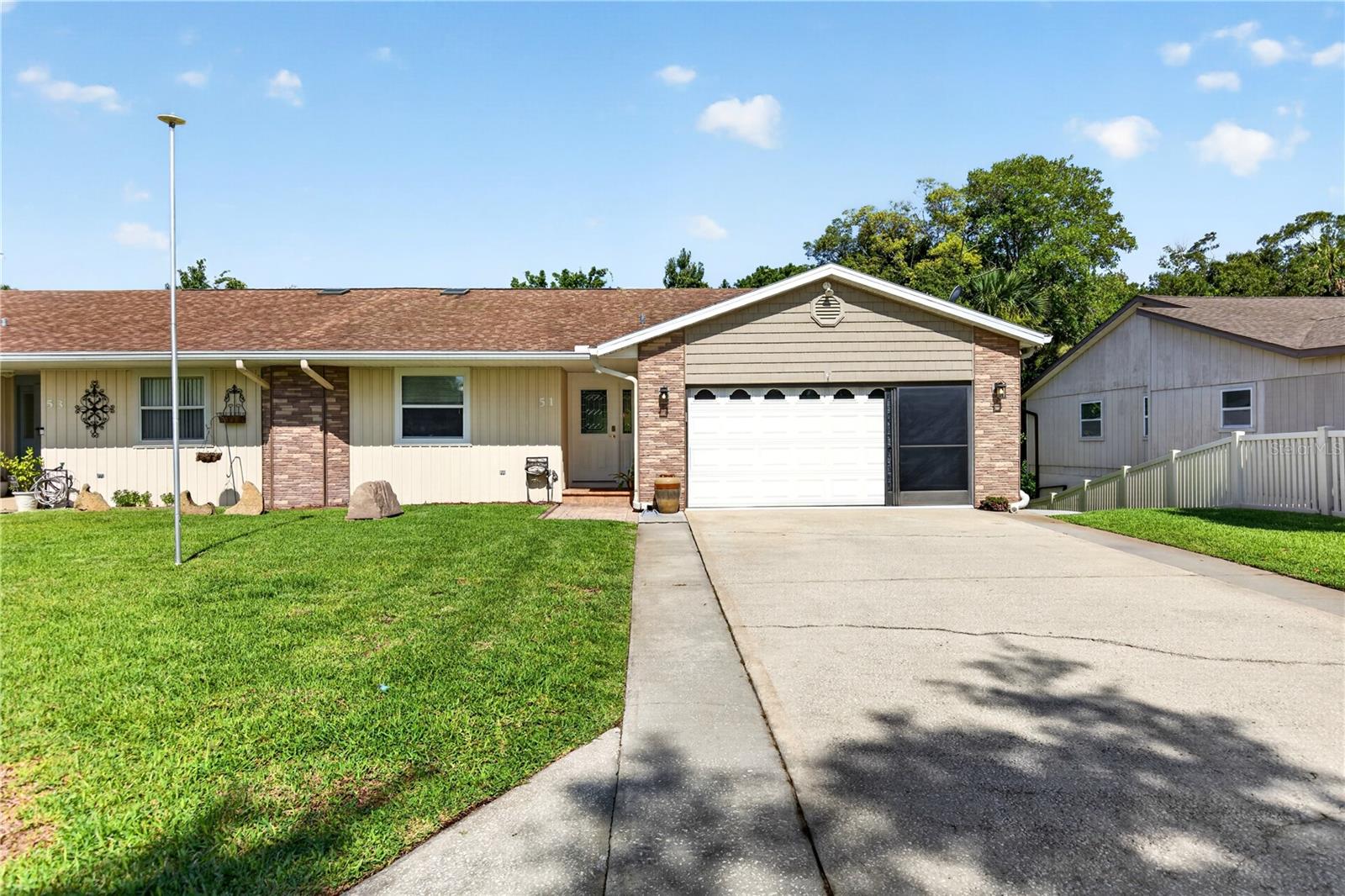 An absolute UNICORN in central Ormond Beach with a fully finished BASEMENT complete with its own kitchen, living, entrance! 2,640sf of total interior, under air living space includes two separate living quarters under one roof. Separate HVAC units, and each with its own private entrance. Just think... multigenerational living, an income-producing lower level, or use it all together as one big happy residence! All newer double-paned windows and sliding glass doors in 2023. Newer architectural shingle roof in 2018.  Entry-level floor with 1,320sf is absolutely spotless and full of natural light. Wide open living area with wood floors, built-in features, dedicated dining area, and a breakfast bar that easily seats 5-6. Kitchen is nice and bright with granite countertops plenty of cabinet space, and two lazy-Susan corner cabinets. Off the dining area is a large, fully redone Trex deck overlooking the fenced back yard, just replaced with vinyl fencing in 2023. Primary suite is generously sized at 14x15ft and has TWO large closets. Guest room is also generously sized and is adjacent to the full guest bathroom with tub/shower combo, new vanity, and new countertops. Upstairs HVAC was just replaced in 2020. The FULLY FINISHED BASEMENT is accessible through the entry level or around back of the property via a recently poured concrete walkway. All tile flooring throughout. The FULL kitchen with electric range, refrigerator, and dishwasher overlooks the living room and has a large island with plenty of seating. Primary bedroom is large at 15x12ft and has two separate closets. Full bathroom with walk-in shower, newer vanity & amp; fixtures. Second bedroom on the lower level does not have a window but is ample-sized and has a built-in closet. Additionally, there is a large utility room that houses the lower-level HVAC handler and could be a nice, spacious storage room or home office. The basement is also home to an incredibly large storage room that currently backs up to the sump pump/water heater - the perfect setup to convert this to a laundry closet! 

As if the home itself isn't enough of a draw, this property comes with a hidden feature. Ormond Beach's best kept secret, Haas Park, is located directly behind this home! Haas Park offers 13 acres of undeveloped land and a half-mile concrete walking trail with an entrance just 300 yards away. 51 Sandpiper Circle is also conveniently located near Ormond Beach's Central Park which offers miles of scenic walking and jogging trails, boardwalks, lakes, nature viewing areas, playgrounds, tennis courts, and the Environmental Discovery Center. The Woodlands is a centrally located NON-HOA community in Ormond Beach. Currently zoned for Tomoka Elementary, Hinson Middle,
and Mainland High School. Located just minutes from The World's Most Famous Beach, Publix, Aldi, shipping centers, banks, pharmacies, and local retailers.

All information and room sizes in this listing are intended to be accurate but cannot be guaranteed. Buyers and their agents are always encouraged to perform due diligence.