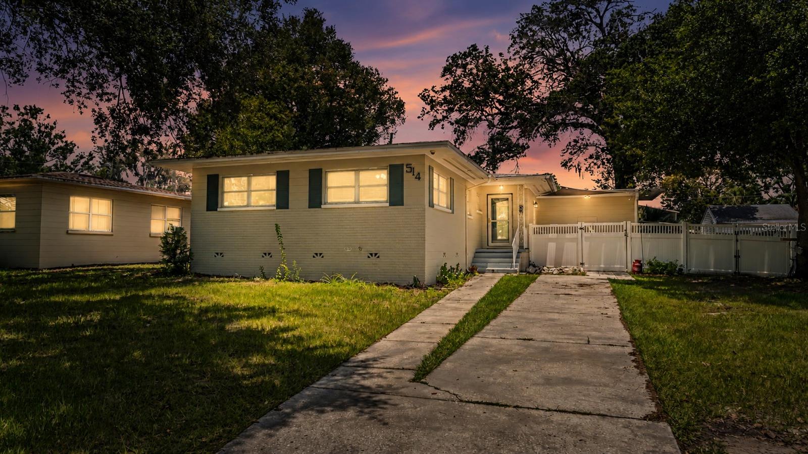 Virtually Staged. Welcome home to this beautifully updated 3-bedroom home! Located in the highly desirable Cleveland Heights community, you will absolutely love the charm and location offered here. If you enjoy taking strolls, you will appreciate the proximity of the Cleveland Heights golf course, Common Ground Park, and picturesque Lake Hollingsworth. Step inside to discover a bright, open-concept floor plan featuring an expansive living and dining area designed to ensure you are always comfortable in this space and your guests always feel welcomed. The updated kitchen is truly the heart of the home, showcasing gorgeous quartz countertops, a large kitchen island, decorative backsplash, tall cabinetry featuring soft-close cabinets and drawers with matching appliances, and a deep kitchen sink perfectly situated below a window overlooking the backyard. Filled with natural light and modern finishes, this inviting space is sure to impress. You’ll also appreciate the easy maintenance of having no carpet throughout the home. Luxury vinyl plank flooring extends through the main living areas and bedrooms, while the primary bathroom features tile flooring and the half bath includes laminate flooring. All three bedrooms are generously sized and equipped with ceiling fans for added comfort. Major updates provide peace of mind, including roof replacement in 2016, upgraded underground electrical service with a newer panel, fixtures, devices, and fans completed in 2017, plus a new 24,000 BTU mini-split unit installed within the last 2 years! Featuring both central air and a mini-split unit provides for additional comfort and efficiency. Some other great features of this home include rain gutters, and a laundry room that is complete with a stackable washer and dryer plus newly added storage racks for extra organization. The outdoor space is a true highlight of this home! A newly installed white vinyl front fence creates an attractive first impression with dual access. Beyond the fence, you'll find a cozy, private courtyard that is the perfect spot for relaxing and even grilling with friends and family, and a large, fully fenced backyard with plenty of room for pets, outdoor activities, play, gardening and entertaining. A storage shed provides extra space for tools, lawn equipment, and seasonal items. With its thoughtful updates, inviting layout, exceptional outdoor space, and proximity to major hotspots in Lakeland, this house is one you will be happy to call home!