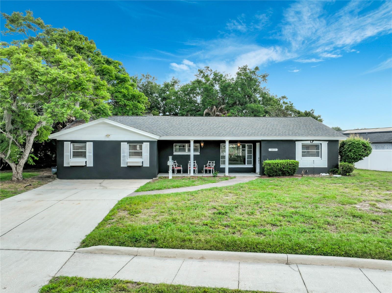 One or more photo(s) has been virtually staged. Welcome to 3417 Pershing Ave, a spacious 4-bedroom, 2-bath home located in the desirable Conway area of Orlando. This beautiful home sits on nearly half an acre, has been well-maintained and offers over 2,500 square feet of living space with a functional and inviting layout. The home features a bright and oversized family room with a cozy wood-burning fireplace and an adjacent indoor grill, perfect for relaxing and entertaining guests. The remodeled kitchen has brand-new appliances, waterfall granite countertops, a stylish pot filler, and opens to the main living area for seamless flow. Throughout the home, you'll find elegant Italian ceramic tile flooring and new lighting fixtures that elevate the space. The luxurious primary bath includes an 8-foot shower with multiple shower heads, and a new tankless water heater ensures energy efficiency. Step outside to a private backyard oasis complete with mature landscaping, a pergola with pavers and a lion's head fountain, and a large 9-foot-deep, 22' x 44' pool with new equipment—ideal for enjoying the Florida lifestyle. Additional highlights include a newer roof, fire-rated interior walls, UNDERGROUND POWER and close proximity to schools, parks, dining, and shopping. This charming home offers timeless appeal and an exceptional opportunity to enjoy space, comfort, and convenience in one of Orlando’s most sought after neighborhoods.