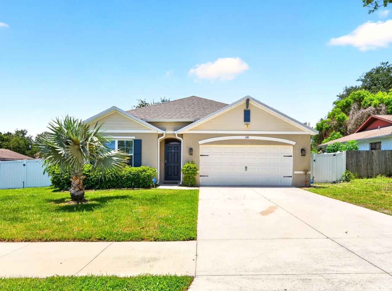 Seller may consider buyer concessions if made in an offer ~ Built in 2021 and well maintained by its original owners, this 4-bedroom, 2-bath home offers the perfect combination of modern construction, energy efficiency, and the freedom of ***NO HOA*** in the established community of Deltona Lakes! Even better, the ***SOLAR PANELS*** can be paid off by the seller with an acceptable full-price offer, and buyers can ask about the ***ASSUMABLE MORTGAGE*** for even more savings. From the thoughtful landscaping to the epoxy-coated garage floor, every detail has been designed with comfort and convenience in mind. Inside, a versatile 3-WAY SPLIT BEDROOM layout provides space for everyone while maintaining privacy. The welcoming foyer leads to an upgraded kitchen overlooking the dining area and spacious living room, where a stylish feature wall with an ELECTRIC FIREPLACE creates a chic and inviting focal point. The chef's kitchen showcases a timeless color palette, granite countertops, STAINLESS STEEL APPLIANCES, abundant cabinet and pantry storage, and a large ISLAND with pendant lighting and casual breakfast bar seating. Sliding glass doors extend your living space to a COVERED LANAI overlooking the large PRIVACY FENCED BACKYARD, complete with a double gate and plenty of room to add the pool you have always dreamed of. Your PRIMARY SUITE is tucked away at the back of the home, quickly becoming a tranquil retreat, featuring a WALK-IN CLOSET along with a well-appointed en-suite bath offering a dual sink vanity, linen closet and private water closet. Located in the established Deltona Lakes community, you will enjoy being just minutes from I-4, shopping, dining, parks, and everyday conveniences, while still feeling removed from the hustle and bustle of Orlando. Spend weekends exploring Lake Monroe, the Central Florida Zoo & Botanical Gardens, or head east to Florida's beautiful beaches. If you are looking for a newer home with room to grow, energy-saving features, and no HOA restrictions, this one checks all the boxes. Call today to schedule a tour and fall in love with your new HOME SWEET HOME!