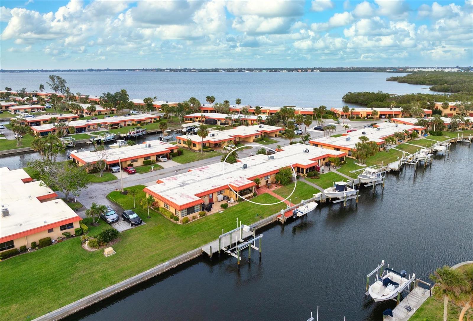 RARELY AVAILABLE 3-bedroom, 2-bath canal-front condo in the gated waterfront community of Palma Sola Harbour, just minutes from the beautiful beaches of Anna Maria Island. This bright and spacious home is offered with some furnishings included and comes with your own private dock with davits, plus direct boating access to Sarasota Bay with no fixed bridges—a boater’s dream. Enjoy peaceful water views from your private paver-brick patio, where dolphins are often spotted playing nearby. Inside, the split-bedroom layout offers great privacy, with a spacious primary suite featuring a large walk-in closet and two guest bedrooms tucked away on the opposite side—perfect for visitors.
You’ll also find an inside laundry room with a full-size washer and dryer, plenty of cabinet space, and extra exterior storage for beach gear, bikes, and more. Palma Sola Harbour offers resort-style amenities including two heated pools, tennis and pickleball courts, clubhouse, fitness center, dry saunas, billiards room, workshop, and putting green. The location is hard to beat—close to shopping, restaurants, and the historic Cortez Fishing Village. Monthly dues are just $675 and include a master flood insurance policy. Two pets allowed. If you’re looking for relaxed waterfront living with great boating access, this one truly feels like home.