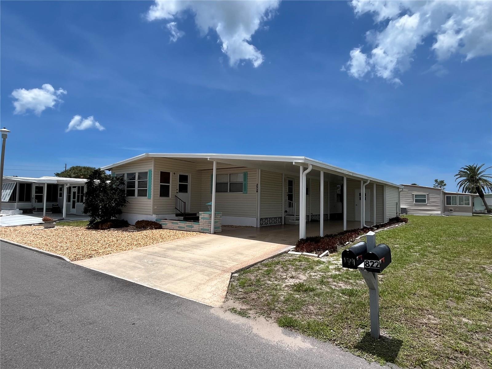 This 2/2 is move in ready, newer vinyl siding, New carport and roof in 2025, newer hot water heater, AC 6-7 years old, repiped with CPVC supply plumbing, huge closets and storage,  fully furnished with everything you would need to set up your home in venice isle. It also boasts a quaint front Florida room and long drive for added space. New electric panels for both inside and out. Eating space in the kitchen too.
Venice Isle is the premier resident owned over 55 Mobile home Park in Venice.  There are close to 1000 homes with the most active residents. There is always something going on for you to do. We have many Park gatherings and first rate shows on site. The Park has every amenity you can imagine. Come take a walk through both of our 2 clubhouses and make yourself at home. The Park has 2 tennis courts, a fitness center, 2 heated pools, 2 hot tubs, saunas, putting greens, shuffleboard, Bocce ball, miniature golf, art rooms, pool room, TV lounges, card rooms, library, horseshoes, ceramic kilns, 2 huge ballrooms, Sunday services and much more!