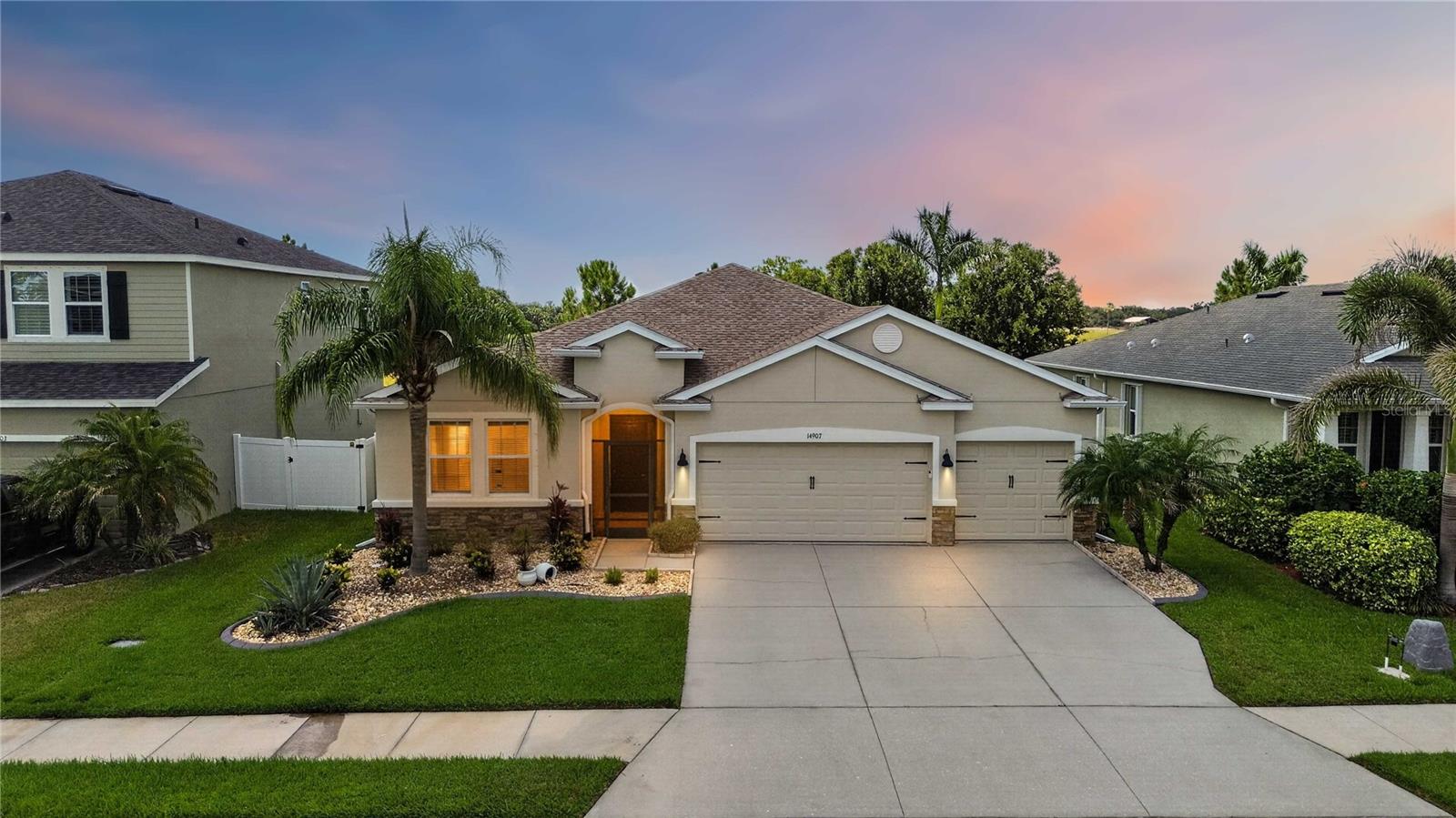 Welcome to this beautifully maintained home in the highly desirable Del Tierra community, where thoughtful upgrades, exceptional privacy, and an open-concept design come together to create the perfect Florida lifestyle. Backing to peaceful green space with beautiful views and no rear neighbors, this home offers a level of privacy rarely found in the neighborhood. Combined with a spacious 3-car garage, low HOA fees, and no CDD fees, this is an exceptional opportunity in one of the area’s most sought-after family-friendly communities.  Inside, the expansive open floor plan is filled with natural light and designed for both everyday living and entertaining. Tile flooring flows throughout the main living areas, while all bedrooms feature comfortable carpeting. The oversized great room opens seamlessly to the dining area and kitchen, creating an ideal gathering space for family and friends. The kitchen offers solid wood cabinetry, stone countertops, a large center island with seating space, stainless steel appliances, and abundant workspace for preparing meals or entertaining guests. All appliances convey with the sale.  A dedicated office enclosed with glass doors provides the perfect work-from-home space while remaining connected to the main living area. Built-in cabinetry, a custom wall-mounted desk, and additional storage make this room as functional as it is attractive. Throughout the home you’ll also find thoughtful upgrades including a built-in entertainment wall unit, upgraded lighting, ceiling fans, and abundant storage.  The split-bedroom layout provides privacy for everyone. The spacious primary suite offers tray ceilings, generous natural light, and an en-suite bathroom complete with dual vanities, a soaking tub, walk-in shower, and oversized walk-in closet. Secondary bedrooms are generously sized and thoughtfully positioned throughout the home.  Step outside to the screened lanai where peaceful preserve views create the perfect backdrop for relaxing or entertaining. A convenient doggie door provides easy access to the fully fenced backyard, enclosed with both vinyl and metal fencing for added privacy and functionality.  Major improvements provide outstanding peace of mind, including a brand-new roof, brand-new belt-driven garage door openers complete with new springs, sensors, keypad, and integrated camera, built-in garage shelving, and a meticulously maintained HVAC system that has been professionally serviced every six months. The home also features a spacious 3-car garage, providing exceptional storage for vehicles, hobbies, and outdoor equipment.  Del Tierra residents enjoy a resort-style lifestyle with low HOA fees that include community amenities, recreational facilities, and maintenance of common areas. Residents have access to a community pool, fitness center, playground, parks, and walking areas, all within one of the area’s most desirable family-oriented communities. With no CDD fees and convenient access to shopping, dining, schools, medical facilities, and major commuter routes, this home delivers the perfect combination of lifestyle, location, and value.  This is a rare opportunity to own a beautifully upgraded, move-in-ready home offering privacy, outstanding community amenities, and one of the most desirable floor plans in Del Tierra. Schedule your private showing today.