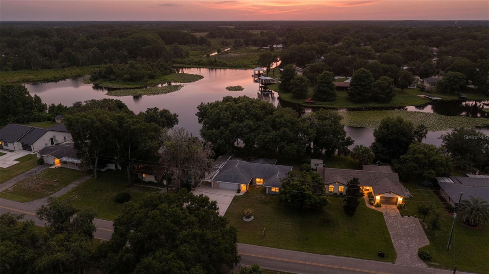 MOVE IN READY Renovated Lakefront Home on Lake Henderson. Part of the Tsala Apopka Chain of Lakes!
This home perfectly combines modern updates with peaceful waterfront living.  Offering direct access to Lake Henderson, one of the most sought after lakes in the Tsala Apopka Chain of Lakes. This incredible chain of interconnected lakes is renowned for its boating, fishing, kayaking, wildlife, and scenic beauty, providing endless opportunities to enjoy Florida's outdoor lifestyle right from your backyard!!!  This stunning 3 bedroom, 2 bathroom home with an attached 2 car garage and covered carport has been remodeled from top to bottom and is truly move-in ready. This light and bright open floor plan offers luxury vinyl plank flooring, NO CARPET, energy-efficient LED lighting, and stylish finishes throughout the home. Lots of natural light through a large window in the living room and a gorgeous wall of windows overlooking the lake, creating a warm and inviting atmosphere. The completely redesigned kitchen is a standout feature, offering soft-close cabinetry, beautiful custom butcher block countertops, a designer tile backsplash, under-cabinet lighting, a deep basin sink, brand-new stainless steel appliances, and a built-in coffee bar. Making it perfect for entertaining or enjoying your morning coffee with tranquil water views. Both bathrooms have been tastefully updated with custom tile accents, new vanities, new toilets, and new exhaust fans, giving each space a fresh, modern feel. Fully permitted underpinning of foundation. Enjoy peaceful lake views from the primary suite, meals overlooking the water from the dining area, or relax year-round in the enclosed porch while taking in the serene surroundings.  The spacious backyard offers plenty of room for entertaining! (No HOA, bring all of your toys, RVs ect.) NO HOA! No Flood Zone! 
Freshly painted driveway with ample parking for multiple vehicles, Rvs, campers, boats. Room for it all. 
- Fully enclosed 160-square-foot detached storage shed
- Whole-house water softener and filtration system
- Recently serviced A/C system and well maintenance completed 
Located just minutes from the heart of downtown Inverness, you'll enjoy one of Florida's most charming small towns. Inverness is known for its welcoming community, locally owned restaurants, unique boutiques, waterfront parks, and year-round festivals. Outdoor enthusiasts will love easy access to the renowned Withlacoochee State Trail, one of Florida's longest paved biking and walking trails, as well as nearby boating, fishing, kayaking, and golf. Whether you're enjoying live music downtown, exploring local shops, or taking in one of the many community events, Inverness offers the perfect blend of small-town charm and an active outdoor lifestyle. If you've been searching for a beautifully updated waterfront home in a peaceful setting that's still close to shopping, dining, recreation, and entertainment, this exceptional property is one you won't want to miss. Schedule your private showing today and experience everything this incredible home and the charming town of Inverness has to offer!