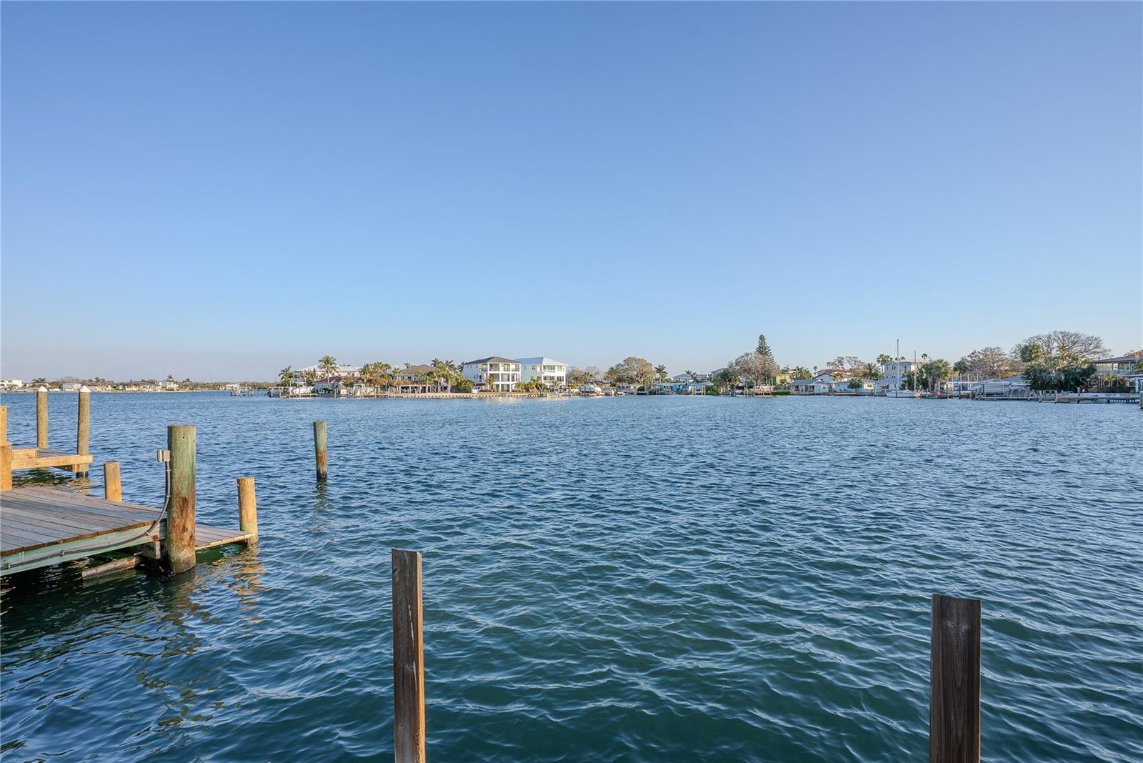 Investor special, cash only in Indian Rocks Beach! Opportunity awaits on this can't miss Intracoastal waterfront property. Nestled in an adorable and sought-after seaside community just minutes from the sugar sands of the Gulf. This property offers prime tear down potential for builders or investors looking to maximize value with a dream waterfront build on a 6700 sqft lot. Alternatively, this coastal cottage can be brought back to life with intentional single-story and ground-floor living. The address supports multiple investment exit strategies. Enjoy direct water access off your private dock for boating, kayaking, paddle boarding, or fishing right from the backyard. Southern exposure protects you from wind and captures the warm sunsets. Golf cart friendly roads allow you to meander your way through tropical paradise, cruise to local establishments, and park in designated parking spots around town.  The lot is situated just two blocks to one of the 24 beach access points and miles of Gulf coastline.  Kolb Park is nearby which features tennis and pickleball courts, a skate park, playground, basketball court, and fields used by IRB Little League and Senior Softball. Zoned for top rated schools and close to local restaurants and shops, the location also provides quick access to Tampa, St. Petersburg, and two International Airports. This is a prime redevelopment opportunity in a high demand coastal pocket, ready for your vision.