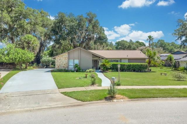 More than just a house—it's a place to call home. This beautifully maintained 4-bedroom, 2-bath residence sits on more than one-third of an acre and reflects years of pride in ownership. Step inside and you'll immediately understand why the same owners have proudly called this home for more than three decades. With a 50-year fiberglass shingle roof installed in 2018 and an A/C system replaced in 2020, this home offers added peace of mind and is truly move-in ready.
Inside, you'll find a lovingly maintained interior featuring wood-look porcelain tile flooring throughout—there's no carpet—offering both easy maintenance and lasting appeal. Don't overlook the custom cabinets and granite countertops in the kitchen and also plantation shutters and 3 sets of french doors throughout.  .Step outside to the oversized enclosed back patio, the perfect spot to enjoy your morning coffee, entertain guests, or unwind in the evenings while overlooking the spacious backyard.