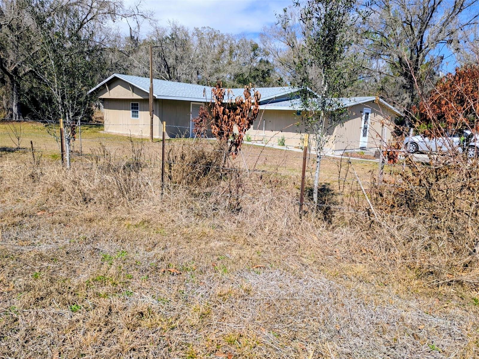Land 3.55 acres with a nice house 3 bedrooms two bathrooms in nice neighborhood, ideal for your home away from home. property sold as is. all rooms measure is estimated' verify information with the county.