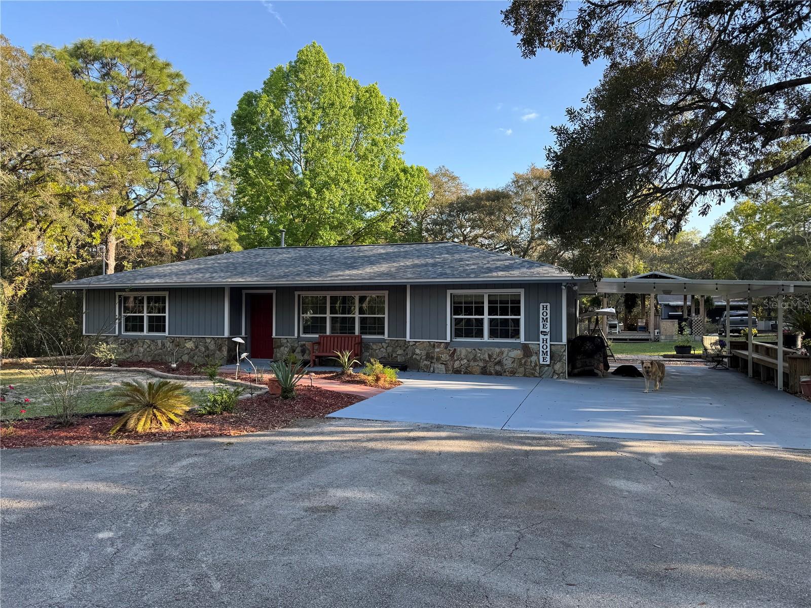 Private Ranch-Style Retreat on 2.5 Acres in Desirable Lecanto, Florida.
Experience the perfect blend of comfort, privacy, and modern upgrades in this beautifully maintained 3-bedroom, 2-bath ranch-style home. Nestled on a quiet cul-de-sac with a newly paved road, this property offers peaceful country living just minutes from the Suncoast Parkway  Gulf Coast and just 50 short minutes from Tampa.  Interior Highlights Spacious split-bedroom floor plan with open-concept living and dining areas Vaulted ceilings and abundant natural light throughout.  Custom kitchen featuring granite countertops, pull-out shelving, mosaic tile backsplash, and tile plank flooring Beverage or wine cooler and dedicated coffee station.  Premium appliances including an ultra-quiet dishwasher and disposal.  Laundry/mudroom washer and dryer hook up with built-in ironing board.
Bedrooms include custom built-in closets, lighted ceiling fans, and updated six-panel woodgrain doors. Modern bathrooms, custom lighting, and a walk-in shower with built-in shower niche and floor-to-ceiling tile.  Exterior & Structural Features 5-year-new 50 year high-definition shingled roof with premium vapor barrier, Jeld-Wen insulated Low-E windows.  Freshly painted interior and elastomeric exterior finish for long-lasting durability.  Screened lanai/Florida room with tongue-and-groove ceiling and wood-grain tile plank flooring. Outdoor Living & Amenities: Expansive workshop with built-in workspaces, shelving, 220 power for RV, half bath, large pantry/dry storage, and covered metal-roof work area. Charming “She Shed” with French doors, abundant windows, and pergola with swing over a paved patio.  Mature landscaping with shade trees, irrigation system, and raised garden beds.  Large covered raised entertainment pavilion with built-in seating, 5/4 wood decking, Outdoor kitchen, BBQ, Bar top area with granite countertop and storage. Well maintained Above-ground pool, Custom wrap-around deck leading to an authentic 8 x16 treehouse with deck overlook.  Hot tub hookup Ready and outdoor shower.
Ample parking for equipment, large rigs and RV space.  Fully fenced and cross-fenced property with automatic security gate.  Zoned for in-law suite or guest home.  This turn-key property offers a rare combination of privacy, functionality, and resort-style outdoor living.
Schedule a private tour today to experience this scenic Lecanto retreat in person.