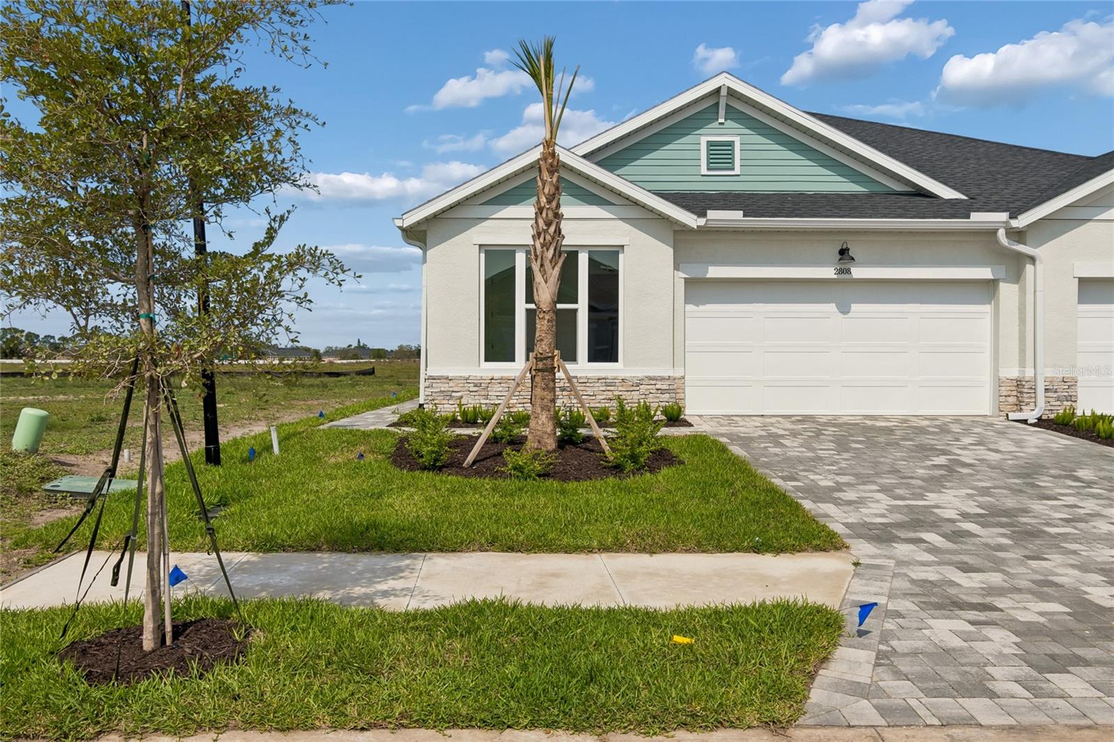 Welcome to The Fieldview by David Weekley Homes—a luxury villa with 2 bedrooms 2 baths + flex room in the gated community of Gracewater, where timeless design meets serene preserve views. With 8' doors, high ceilings & oversized windows, natural light fills every room, creating a bright and inviting atmosphere. At the heart of it all, next to our grand dining room, an elegant kitchen, featuring gas cooking, classic white cabinetry with a striking natural wood island accent, topped with 3cm quarts & finished with elegant hardware. A place of connection — where favorite recipes are shared; conversations linger, and everyday moments turn into cherished traditions. Designed as a personal retreat, the owner’s suite offers large windows, a generous bedroom, an oversized walk-in closet, and a spa-inspired bathroom for the ultimate unwind.
More than just a stunning home, The Fieldview is thoughtfully designed for comfort,  effortless living, and the beauty of everyday moments.

Step outside and embrace the resort-style lifestyle of Gracewater. The Pura Vida Club invites you to unwind by the cabana-lined beach entry pool, play pickleball, stay active in the gym, or let your on-site lifestyle manager arrange your perfect day. Enjoy leisurely dog walks to Peppa Park, soak in the sunshine, and savor every moment. The Bishop isn’t just a home — it’s your everyday vacation retreat. **This property offers a limited-time interest rate incentive.