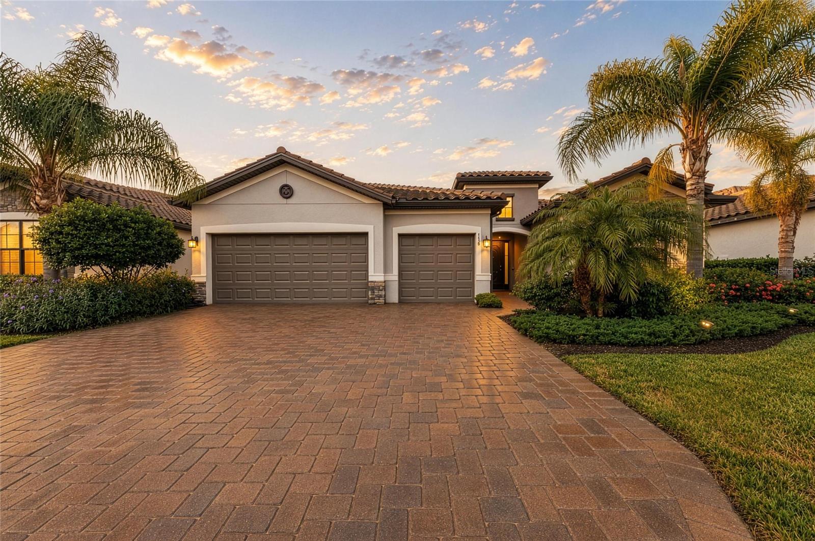 Welcome Home to Lakefront Luxury in Copperleaf Step into exceptional lakefront living with this stunning Summerville II — one of Lennar's most coveted floor plans — tucked inside the gated, maintenance-free community of Copperleaf. Built in 2018 and impeccably maintained, this 3-bedroom, 3-bath home offers 2,455 square feet of thoughtfully designed living space, a private office/den, and an oversized 3-car garage, all set on a premium waterfront homesite with plenty of room to add your dream pool. No CDD fees and no flood zone designation mean peace of mind is built right in. The curb appeal starts strong, with a stone-accented exterior, paver driveway, and elegant double glass entry doors setting the tone before you even step inside. Once you do, soaring 10-foot ceilings, 8-foot interior doors, tray ceilings, and abundant natural light showcase the craftsmanship found throughout. The open-concept great room impresses with custom ceiling accents, LED lighting, and a modern fireplace, flowing seamlessly into a gourmet kitchen anchored by an expansive 11-foot island — ideal for entertaining — plus generous cabinetry, upgraded fixtures, and prep space for the home chef. Unwind in the luxurious owner's suite, where tray ceilings, custom wood accents, and a private sitting area create a true escape. Dual walk-in closets and a spa-inspired bath with dual vanities, a soaking tub, and a walk-in shower round out the retreat. A smart split floor plan gives everyone their space, with a private en-suite secondary bedroom, a third bedroom offering flexibility for guests or family, and a double-door office perfect for working from home.
Beyond the main living areas, thoughtful touches continue throughout — from designer lighting and finishes to generous storage and a laundry room designed for everyday convenience. Every detail reflects a level of quality that's increasingly hard to find. Slide open the oversized glass doors to your covered, screened lanai and take in tranquil lake views and unforgettable Florida sunsets — an everyday backdrop for morning coffee, evening entertaining, or simply unwinding after a long day. Copperleaf residents enjoy resort-style living with a heated community pool, lawn maintenance, cable, internet, and reclaimed irrigation, giving you more time to enjoy the Florida lifestyle and less time on upkeep. Ideally located just minutes from Lakewood Ranch, UTC, championship golf courses, top-tier shopping and dining, Sarasota-Bradenton International Airport, and the Gulf Coast's world-class beaches, this home puts everything you need — and everything you love — within easy reach. Homes like this, on premium waterfront homesites in gated, amenity-rich communities, don't come along often. Schedule your private showing today and experience lakefront luxury living in Copperleaf for yourself.