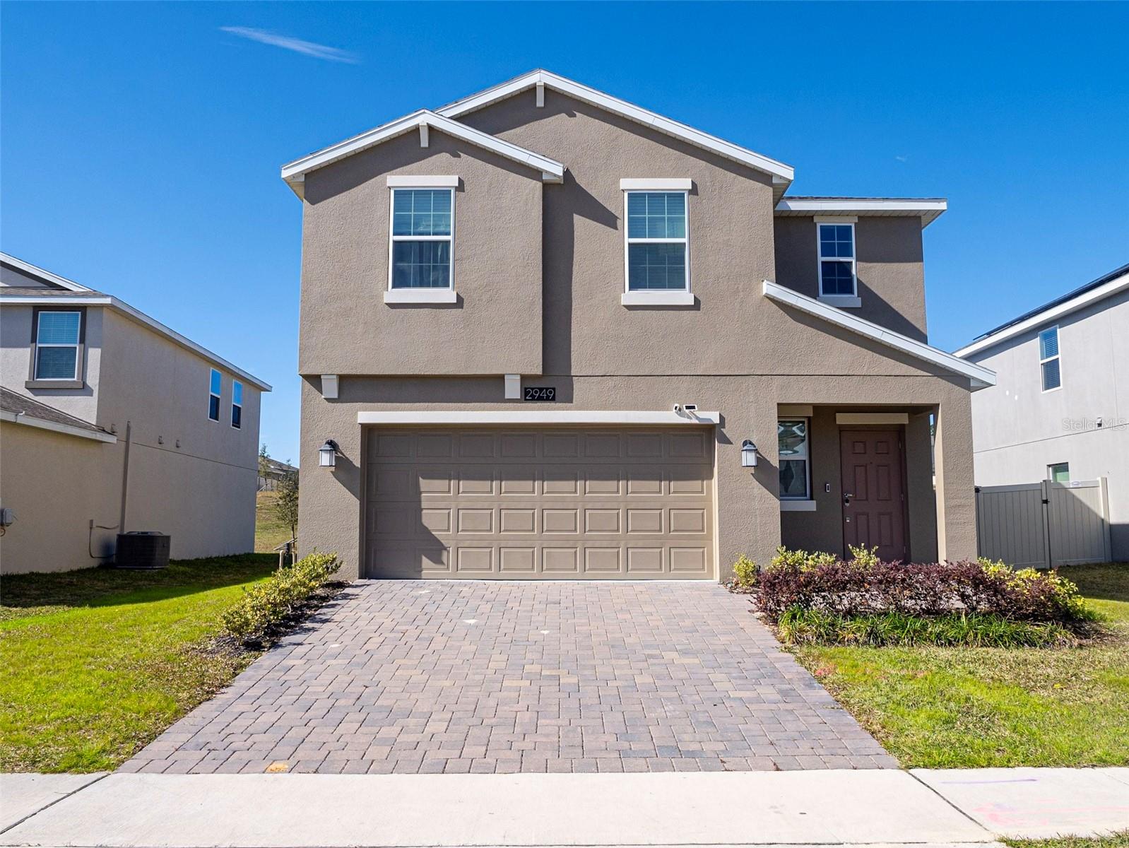 Welcome to this beautifully maintained 4-bedroom, 2.5-bathroom home located in a sought-after gated community in Ocoee. Offered fully furnished, this impressive residence has seen minimal use and showcases a like-new condition throughout. The thoughtfully designed open-concept floor plan provides a seamless connection between the living, dining, and kitchen areas, creating the perfect space for entertaining guests or enjoying everyday living.

The stylish kitchen features modern stainless-steel appliances, ample cabinetry, and plenty of workspace for cooking and gathering. Spacious bedrooms and well-appointed bathrooms offer comfort and functionality for the entire family.

Ideally situated near major highways, shopping centers, grocery stores, dining, and entertainment, this home combines convenience with a vibrant community lifestyle. Residents enjoy a welcoming neighborhood atmosphere and access to a variety of community amenities and activities. Don't miss this rare opportunity to own a move-in-ready home that truly has it all!