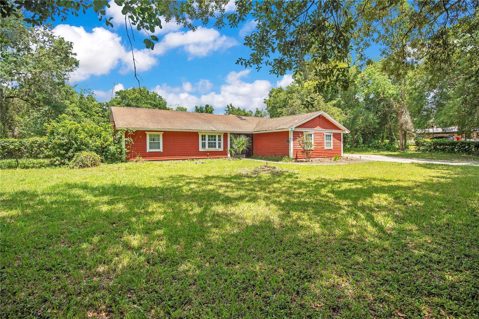 Discover an incredible opportunity in desirable Debary! This spacious 3-bedroom, 2-bathroom single-family home sits on a full 1-acre lot and offers approximately 1,871 sq ft of living space. Built in 1984, this property is a true fixer-upper with tremendous potential for the savvy buyer or investor looking to create equity through updates and personalization.
Step inside to find a functional split-bedroom layout with a flexible bonus space from the former garage conversion. This area works perfectly as a home office, family room, or additional living space. The kitchen overlooks the living area, and French doors open to a large screened lanai—perfect for enjoying Florida breezes while overlooking the private in-ground pool.
Outside, enjoy the oversized 1-acre lot with mature oak trees, lush landscaping, and that classic Old Florida charm. A standout feature is the detached 40x40 workshop with multiple roll-up doors (including RV-sized access)—ideal for hobbies, storage, business use, or extra parking. Additional outdoor amenities include a dog run, irrigation system, and plenty of room for entertaining or future expansions. The home features well water and a septic system with no HOA.
This property provides a blank canvas for modern updates—think fresh interiors, updated kitchen and baths, new flooring, and more. With strong market values in the area, there's excellent upside potential for the right owner. Nestled in a peaceful, rural-residential setting in Debary, you're close to amenities while enjoying space and privacy, with convenient access to major roads, shopping, dining, and recreation in Volusia and Seminole Counties. Nearby schools include Debary Elementary, River Springs Middle, and University High School.
Whether you're a first-time renovator, flipper, or someone seeking a large-lot home to make your own, 121 Azalea Rd represents a fantastic opportunity in Central Florida. Don't miss out—schedule your showing today and turn this diamond in the rough into your dream property!