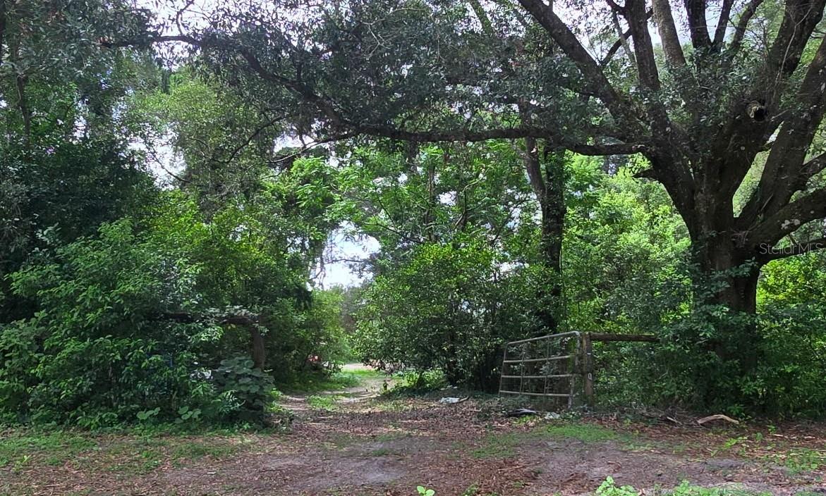 Great price on almost 5 Stunning acres!! This property is perimeter fenced, has a large paddock as well as a 6 stall horse barn. The home onsite will need to be replaced, but the Electric and Well are working. There is a septic system, condition not known. Site built, Manufactured, Modular, Barndominium are all allowed!! Great location!!