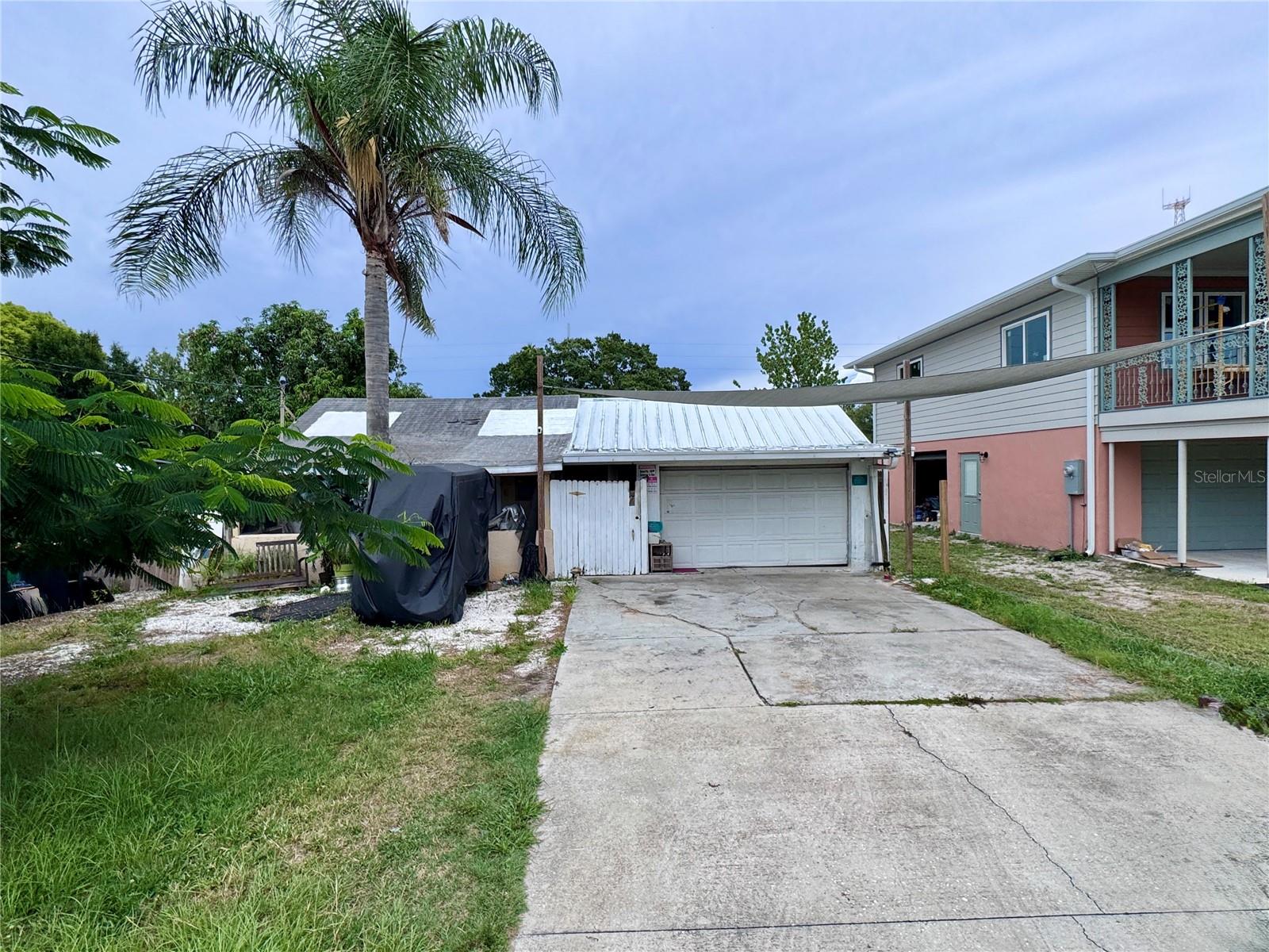 Unlock the potential of this prime investment opportunity in a desirable Clearwater location. Situated in an X Flood Zone, this 1-bedroom, 1-bath home features a one-car garage, bonus room, rear deck space, and a newer electrical panel and tankless water heater, offering added versatility and potential for investors, builders, or developers looking to renovate, rebuild, or expand their portfolio. Located across from a new residential construction project in the neighborhood.
Ideally located near the vibrant downtown areas of Clearwater and Dunedin, with easy access to local dining, shopping, entertainment, and the beautiful Gulf beaches. Property is being sold as-is and is cash only due to its condition. Bring your vision and make the most of this exceptional opportunity.