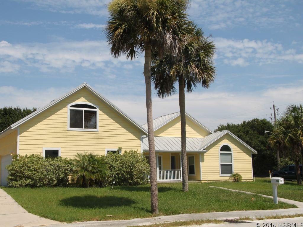 Key West beach style home at walking distance to elementary school and beach!! Newer corner lot home built in 2006. Home offers an amazing living space with an open floor plan, high vaulted ceilings, modern lighting throughout, lots of windows allowing natural light. In the heart of the home is a gourmet kitchen with granite counter tops, stainless steel appliances and a focal wall-mount range hood, as well as maple cabinets. Wood burning slate fireplace, ceramic tile and oak wood floors throughout the home. French doors in living area and master suite. Master bathroom features travertine tile and spacious walk-in closet. All other bedrooms also boast of generous closet space.  Other features include metal roof, poured concrete walls, hardy board siding and stucco, 2 a/c units, all windows are up to 2004 hurricane code and over-sized 2 car garage. On the 2nd level, you will find a huge bonus room that can be used as a 5th bedroom, office or family/play room. There is also room for a pool. Not only this home is functional but offers a cozy and homey feel! A must see! All measurements are approximate. ;Water: City