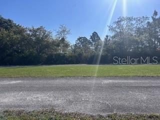 Each parcel in Indian Lake Estates is unique and deserves its own description. This rare ACRE offering combines two parcels and is on a private, paved road inside the gate. And this part of Red Grange Boulevard is the less busy side, but close to everything. If you are looking for a homestead, the road has electric available. Septic is required and private wells are common, but this lot is also eligible for the community water tower. If you are an investor, this is a desired feature in the neighborhood. With two parcels, you are permitted to build two homes or combine the two parcels and place your home with natural buffers all around. DeSoto Road was renamed Red Grange Boulevard in honor of its most famous resident. The talented University of Illinois football player (aka "The Galloping Ghost") became famous when scoring five touchdowns in one game against University of Michigan and went on to play for the Chicago Bears and is a charter member of both the College Football Hall of Fame AND the Pro Football Hall of Fame. The roads are private, so drive your golf cart down the road one mile to the clubhouse for a round of golf, or to eat at one of the two restaurants in the neighborhood, or take a little longer ride to the lake to watch the sunset from over the water. As you begin to plan your future in Florida, consider living a nice, private life in this neighborhood of Indian Lake Estates (informally, ILE). And when you feel like socializing, the active community offers concerts, karaoke and trivia nights, card games, bingo, golf scrambles, movie nights, a book club, plus basketball, pickleball and tennis courts, just to name a few. Indian Lake Estates is a perfect balance of privacy and activity.