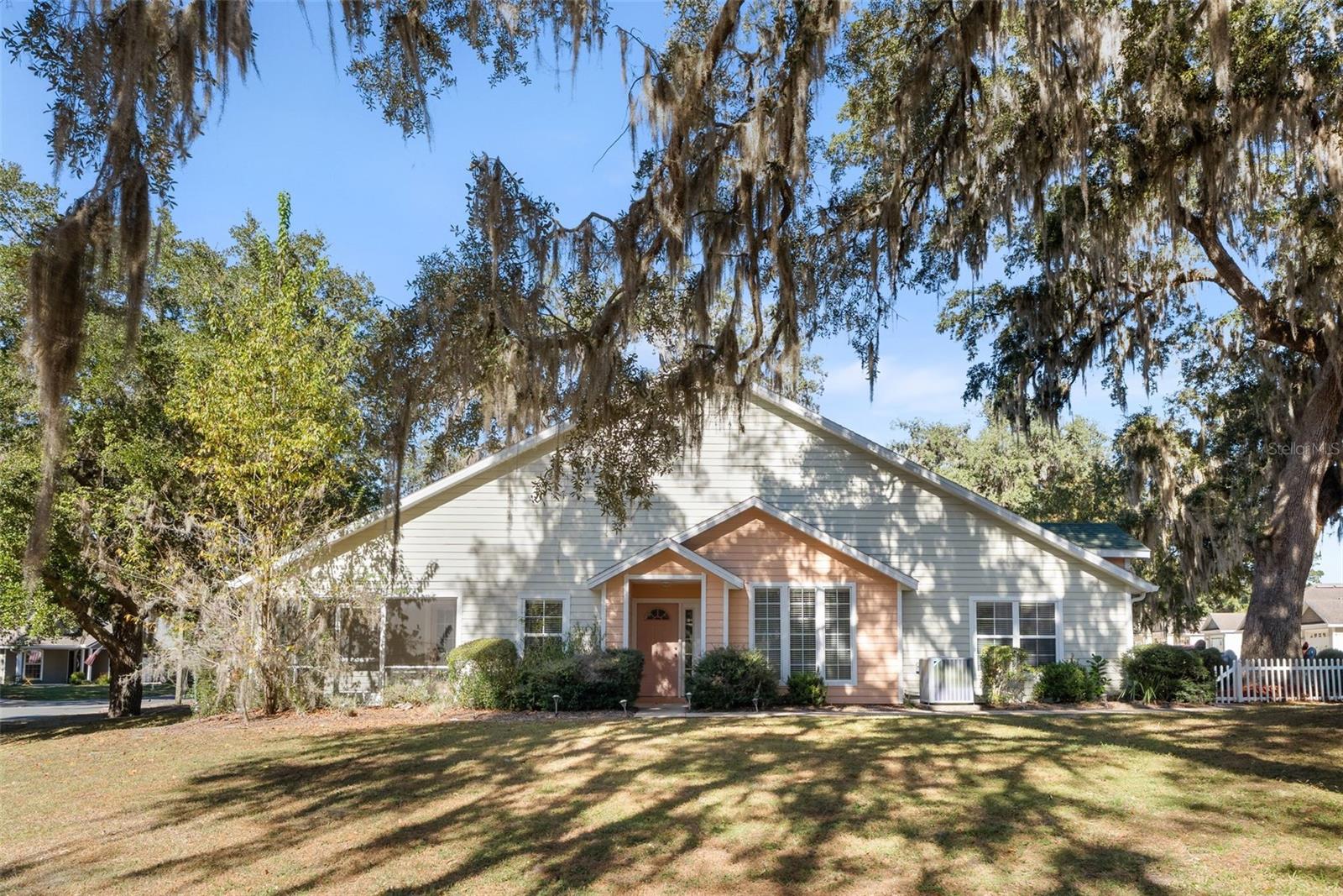 Discover comfort, convenience, and low-maintenance living in this beautifully kept home in the desirable St. Albans Wood community. This 2-bedroom, 2-bath residence offers a smart single-story layout with 1,243 sq ft and a welcoming covered front porch. Step inside to an open living and dining area with vaulted ceilings and abundant natural light. The kitchen is well-designed with ample counter space and an easy flow for everyday living or entertaining. The primary suite features generous closet space, an ensuite bath, and direct access to the screened lanai. The second bedroom offers excellent flexibility for guests, work, or hobbies. Enjoy quiet mornings or peaceful evenings from the private screened lanai overlooking the yard. The home’s location provides quick access to shopping, dining, parks, and all that Alachua and the greater Gainesville area offer. With thoughtful design, functional spaces, and a peaceful setting, this home provides the simplicity and ease that make everyday living feel effortless.