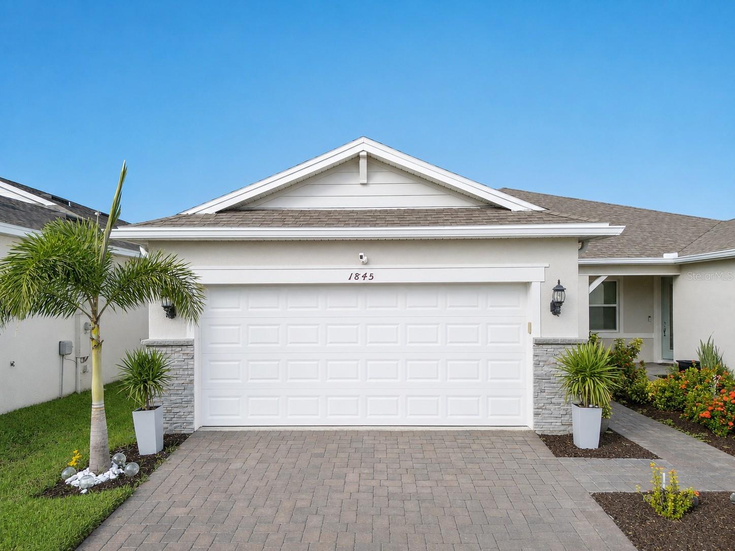 Beautiful meticulously maintained Villa in a 55+ gated community, Tohoqua Reserve. This move-in ready home features lots of upgrades. This spacious 2-bedroom, 2-bathroom home features a versatile bonus/flex room, perfect for an office, or can be easily converted into a third bedroom. Upon entering the home, you'll notice the beautiful crown molding throughout the home, and an abundance of natural light filling the living space. The open floor plan combines the kitchen, dining, and living areas, creating a beautiful open, bright and welcoming space. The kitchen features lots of storage space, a pantry, gray cabinets, quartz countertops, an island, and stainless-steel appliances. Through the triple sliding glass doors is a screened-in covered lanai, with extended pavers and artificial grass, perfect for relaxation. The large main bedroom offers a bathroom with a dual sink vanity, tile shower, linen closet, and a large walk-in closet. The 2-car garage features an upgraded epoxy floor for improved durability and sleek appearance.

This community offers excellent recreational amenities, including access to 2 resort-style pools, clubhouse, tennis, pickleball courts, bocce ball court, fire pits, fitness centers, playground, and miles of outdoor scenic walking trails. Tohoqua Reserve is conveniently located near US-192 and the FL Turnpike and is within 30 minutes of Orlando International Airport and Disney World. Lots of shopping centers nearby and close to the beautiful Saint Cloud Lakefront area.